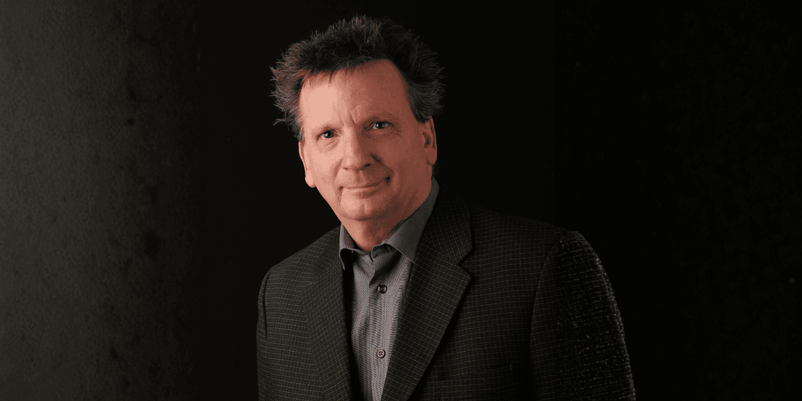 Portrait of Don Somerville, motivational speaker and musician known for blending music and inspiration in keynote presentations.