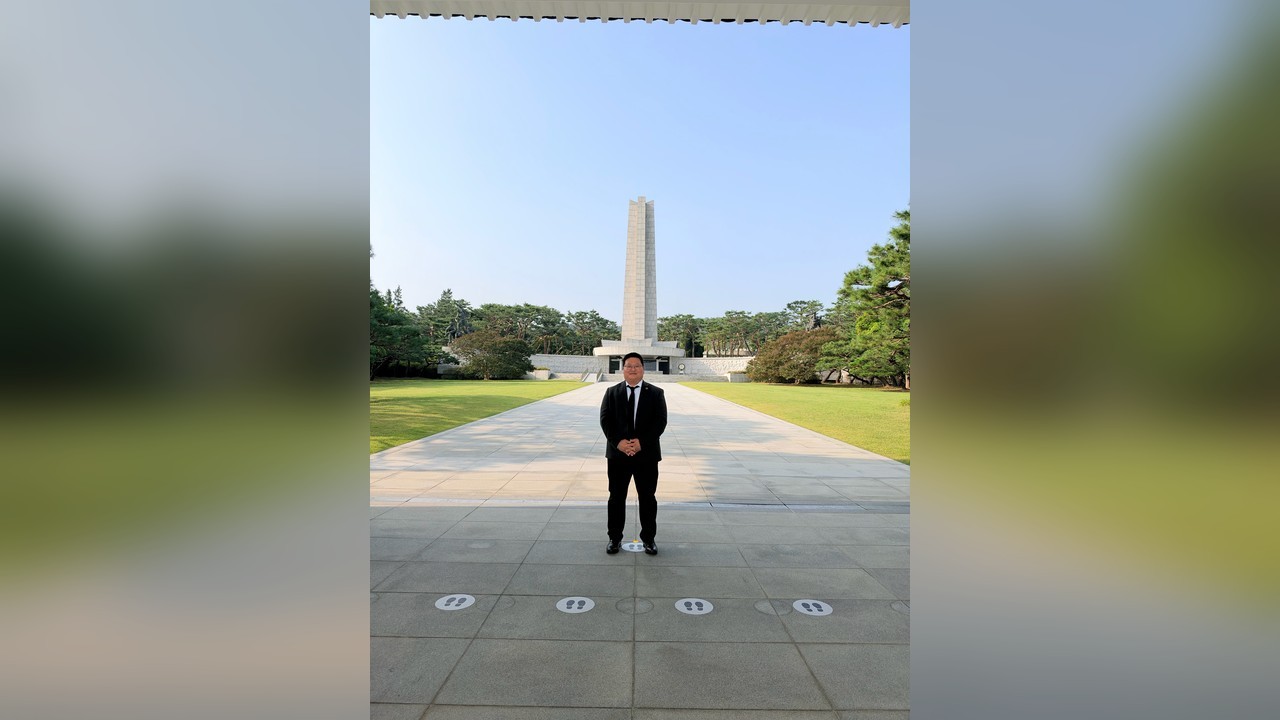 Linkplus founder Ben Ahn at the memorial tower of Seoul National Cemetery during the KACCUSA next-generation leaders visit, 2026