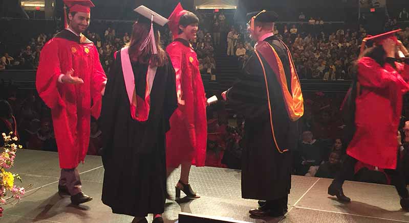 receiving diploma from graduation