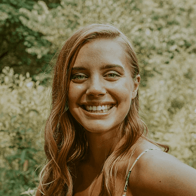 a man with a goatee smiles at the camera