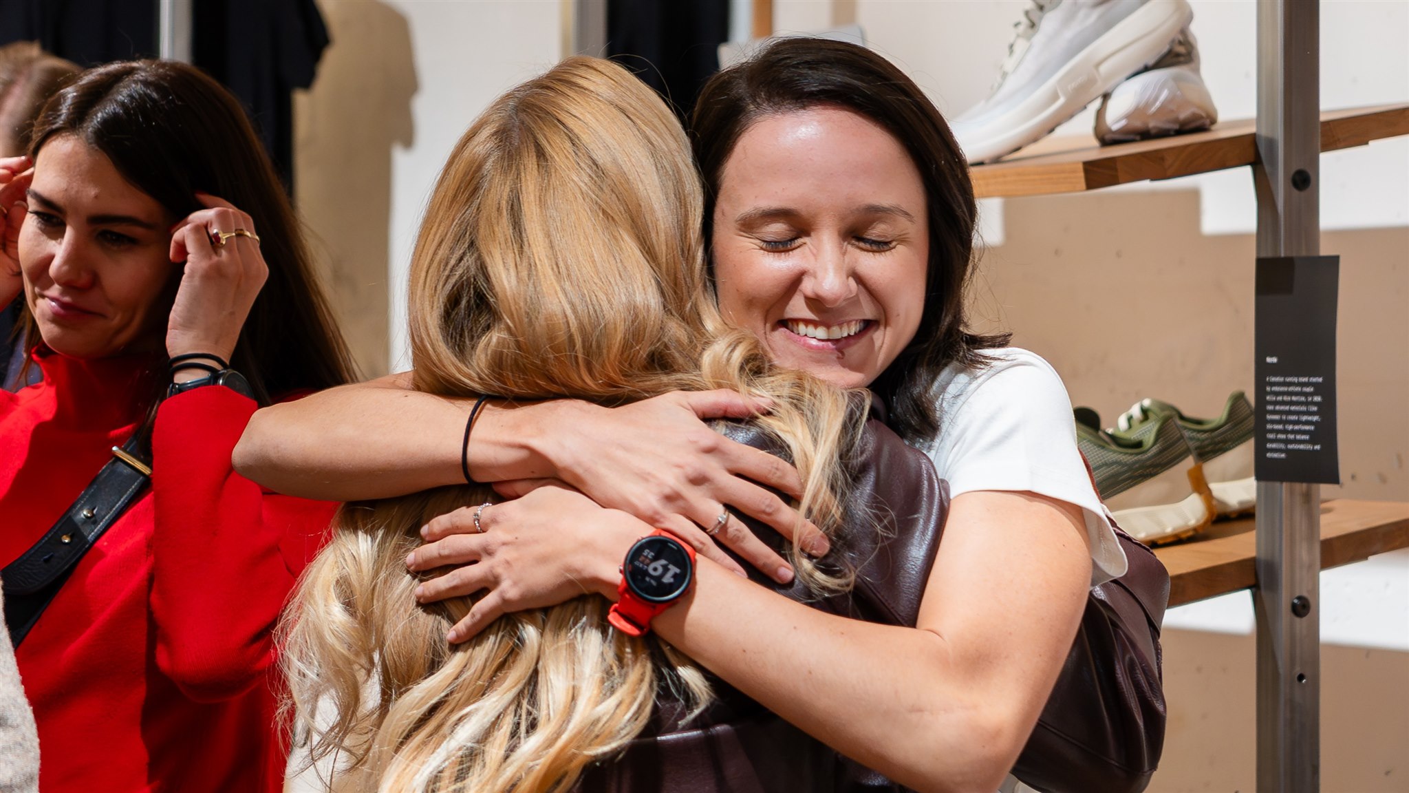 Guests hugging during product launch event Zurich