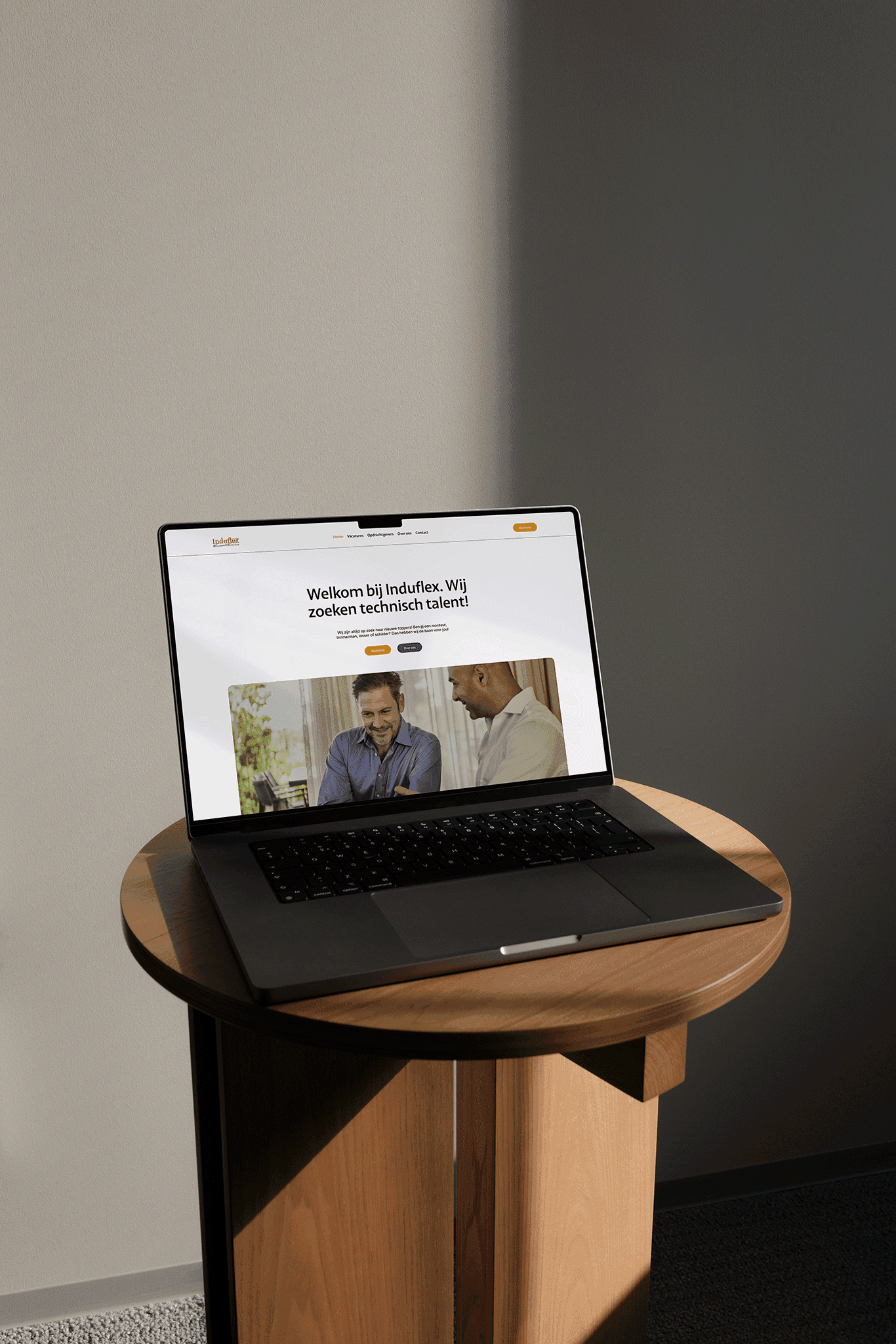 Image of a laptop on a table with a website on screen