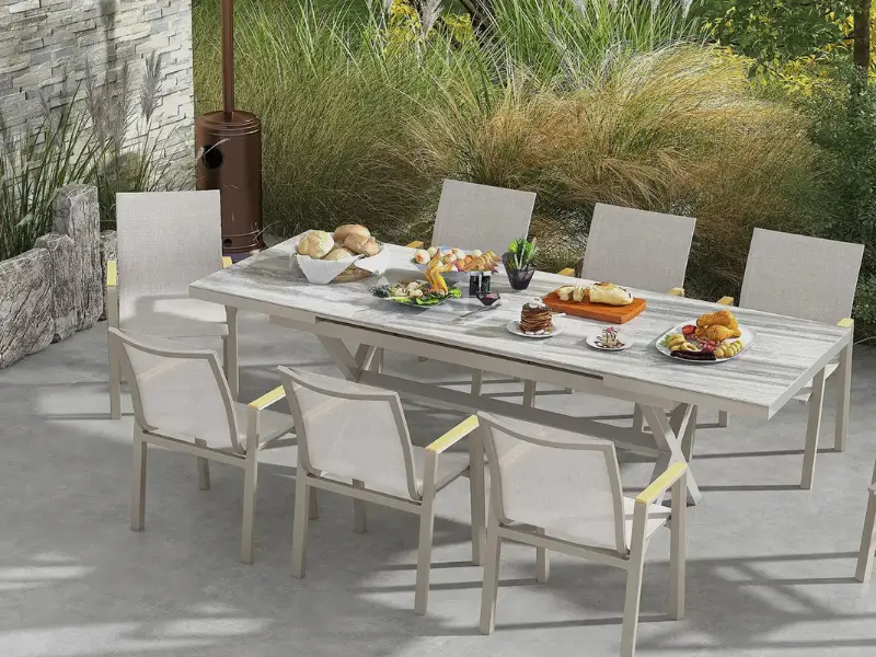 Contemporary 8-seater patio dining set with grey table and modern outdoor chairs.