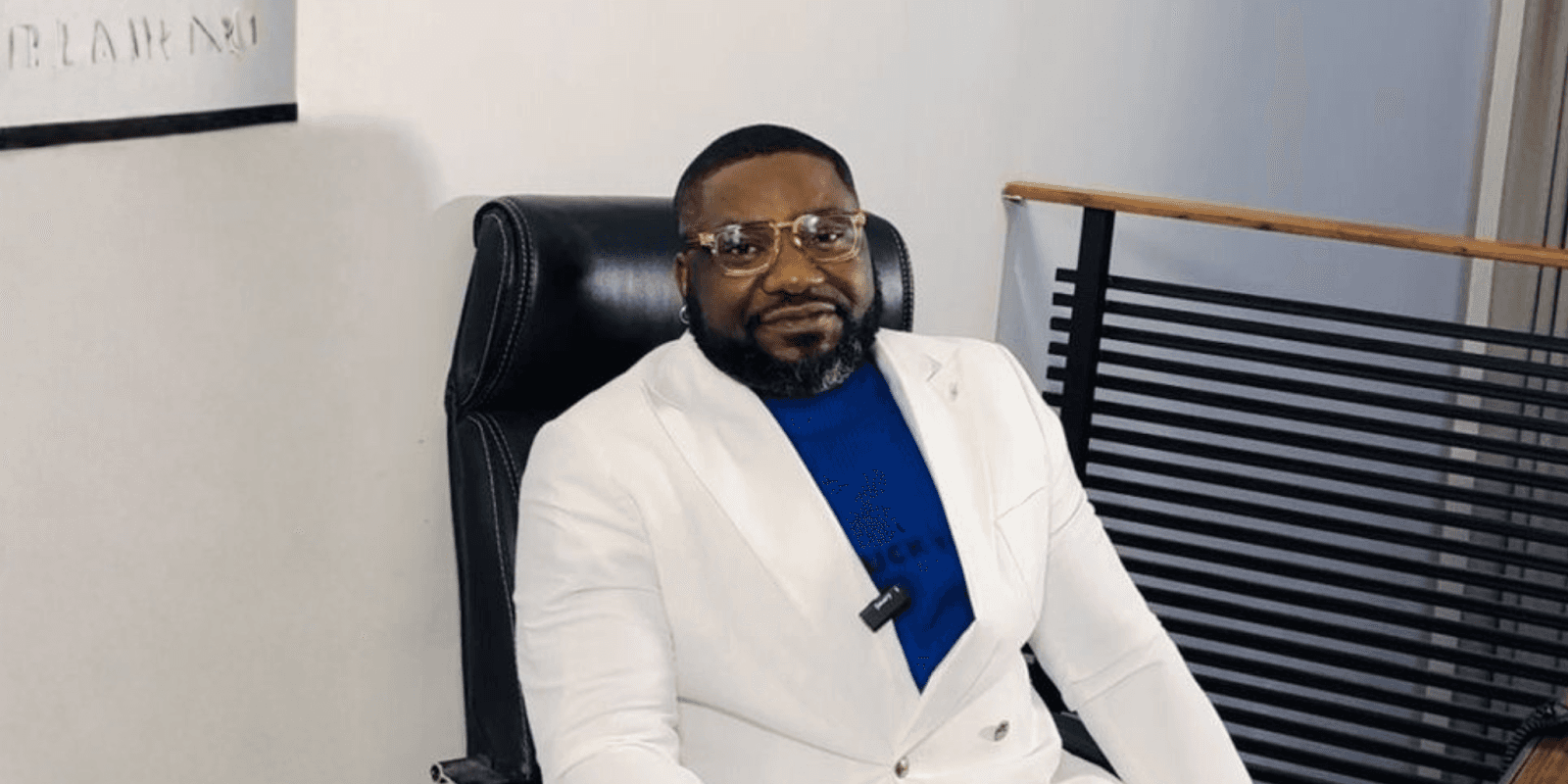 "Jephthah Abanum, founder of RendezvousCare, seated in a professional setting, embodying his mission to empower through personal growth and wellness."