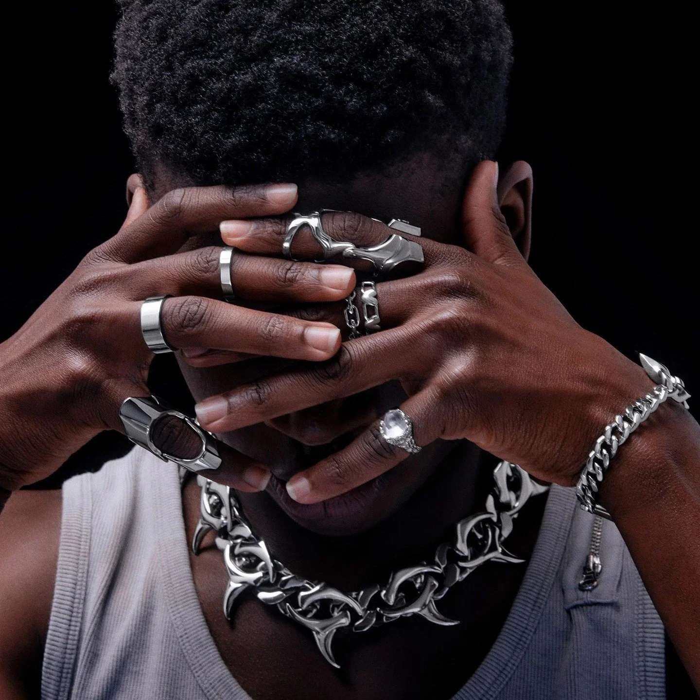 Hands wearing rings and accessories