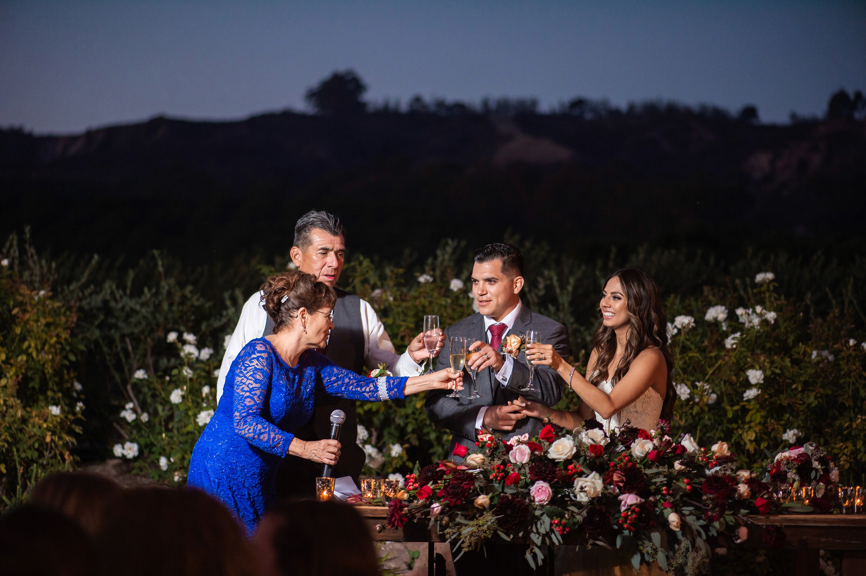 Flat lay wedding details with bouquet, rings, and sparkling bridal heels