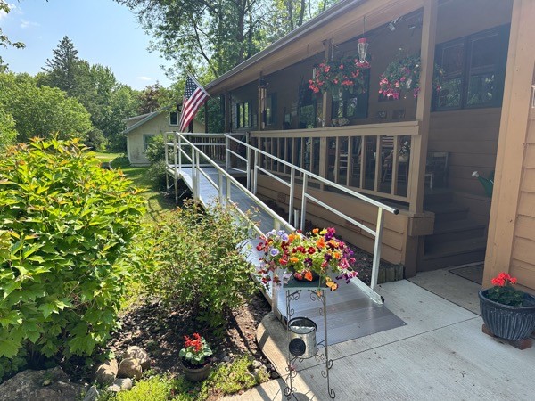 Front porch handicap accessibility ramp with flowers