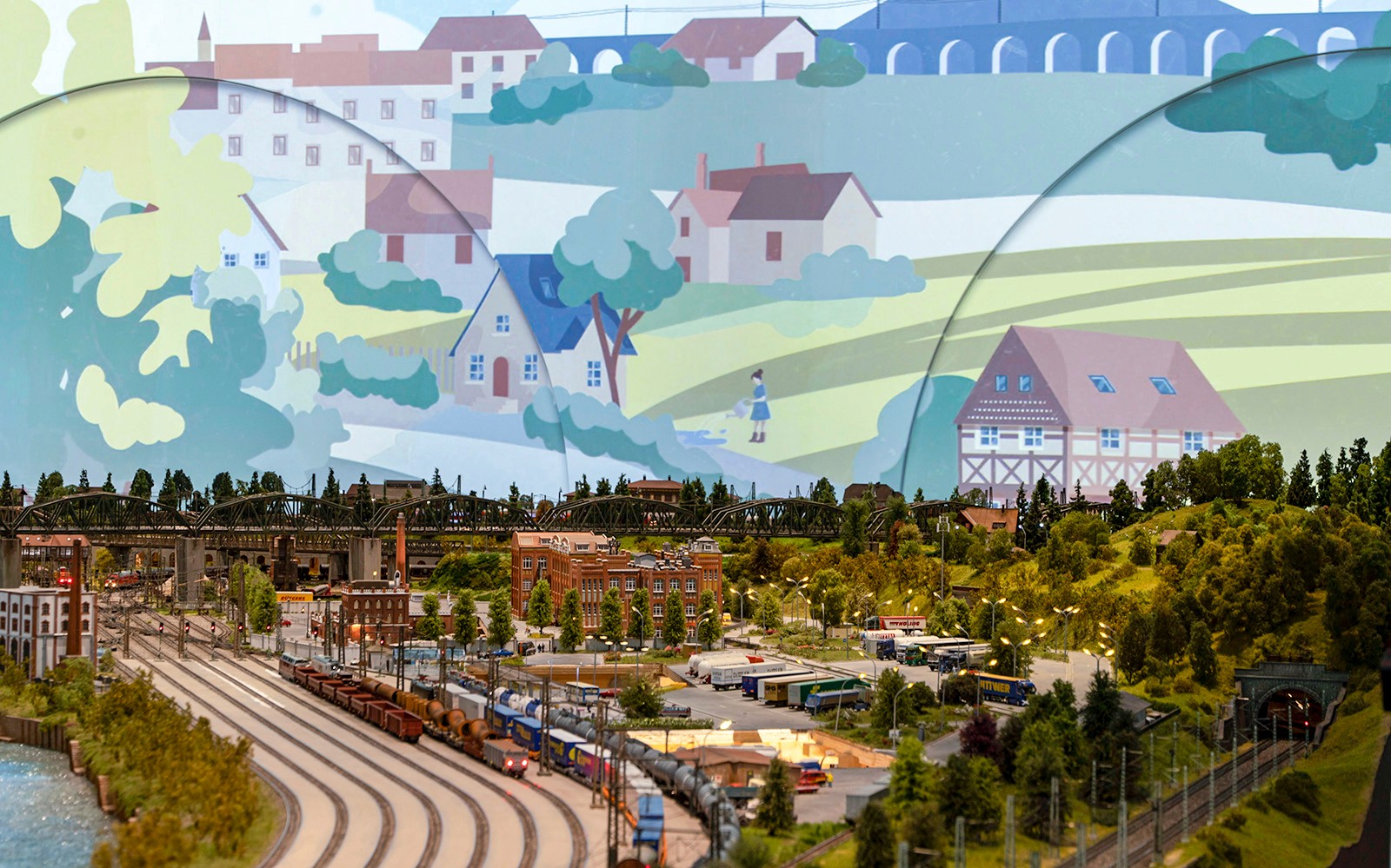 Paesaggio ferroviario in miniatura a Hzero con dettagliati binari del treno e modelli di edifici.