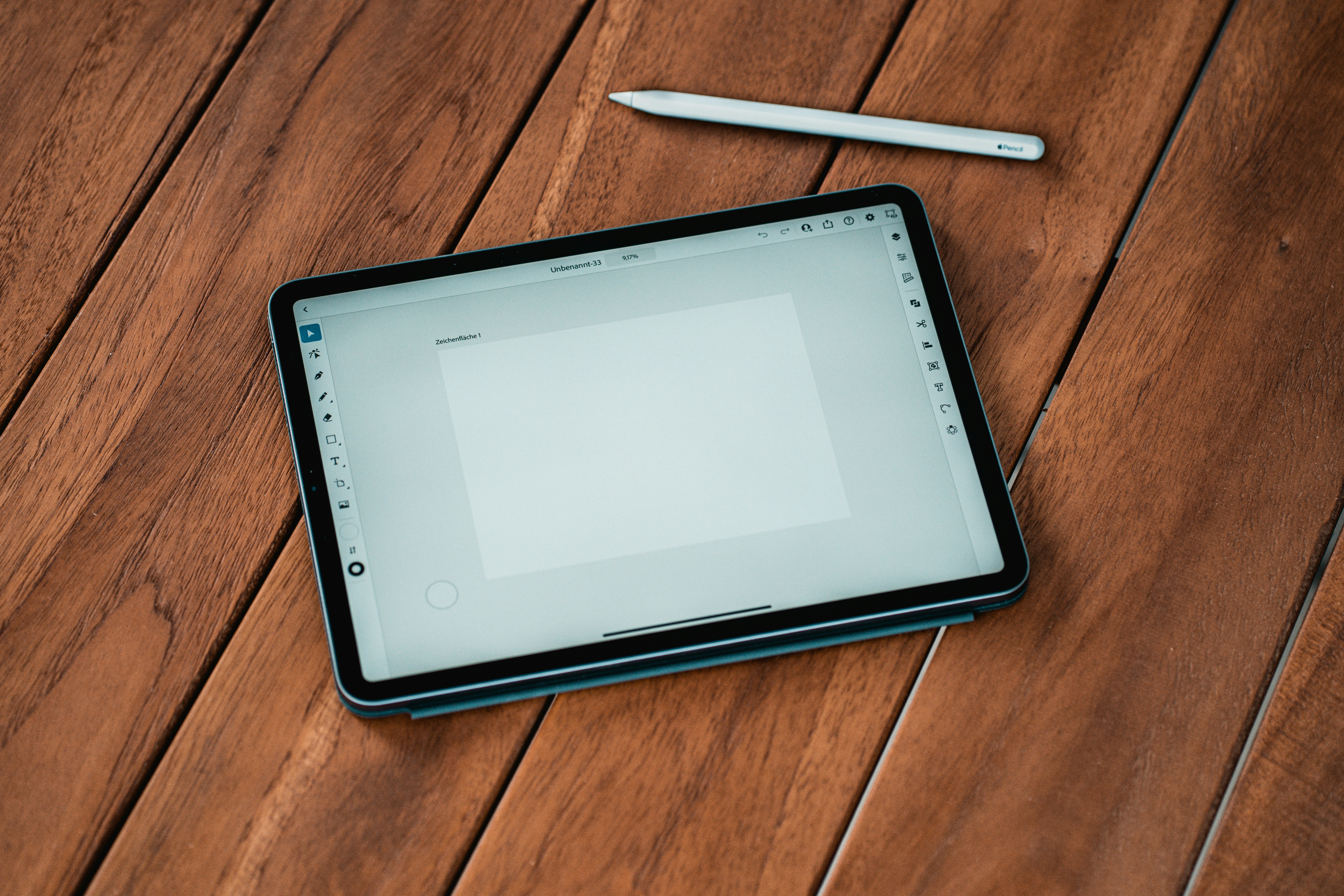 Tablet and stylus on wood