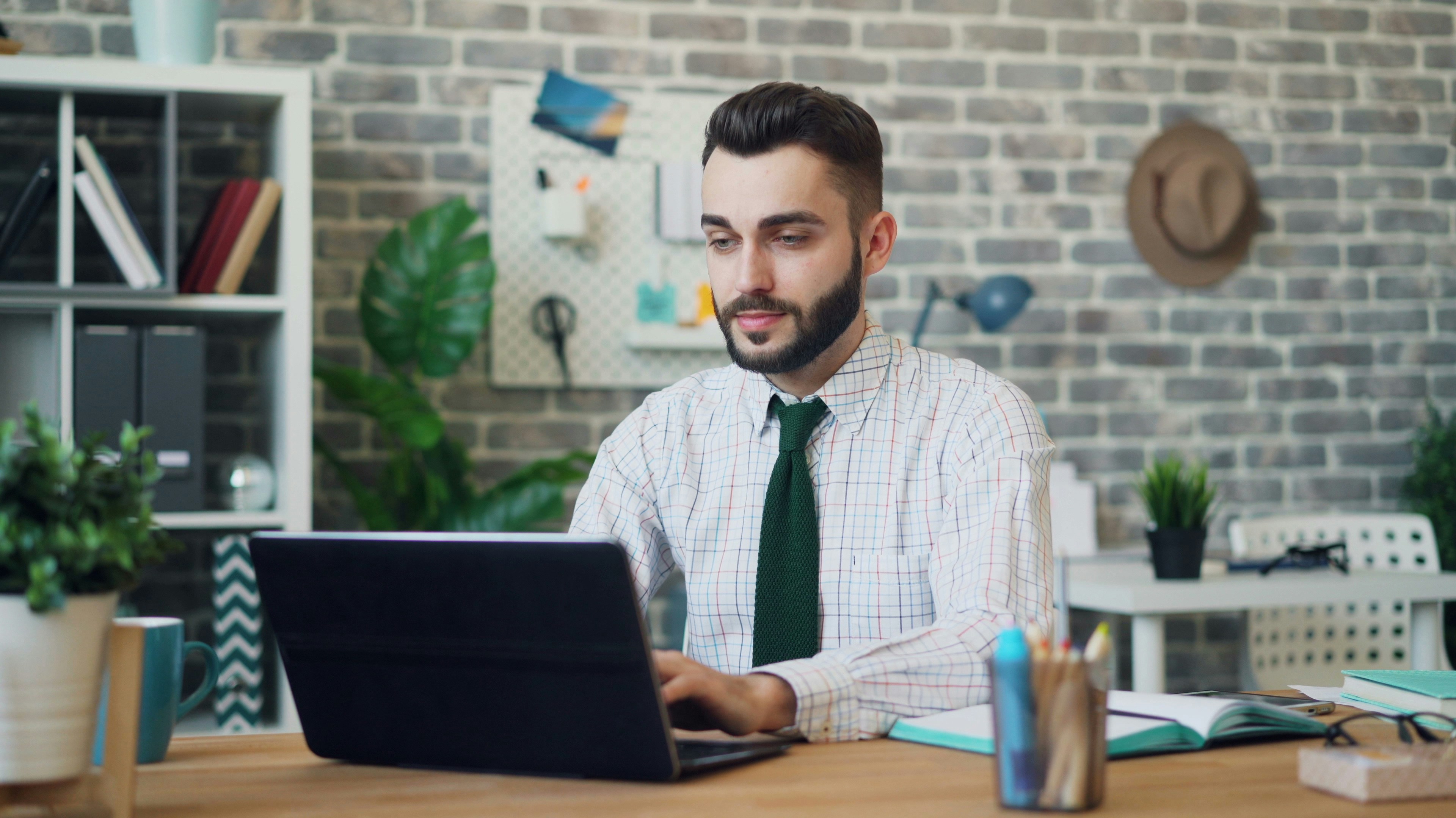 man in his office working with Caktus AI Alternative