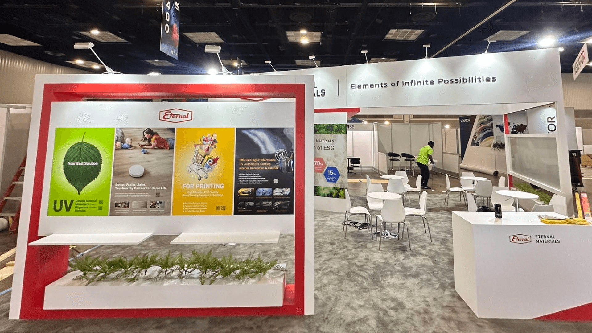 Portable trade show display with integrated screen, lighting, concealed cables, and coordinated booth finishes.