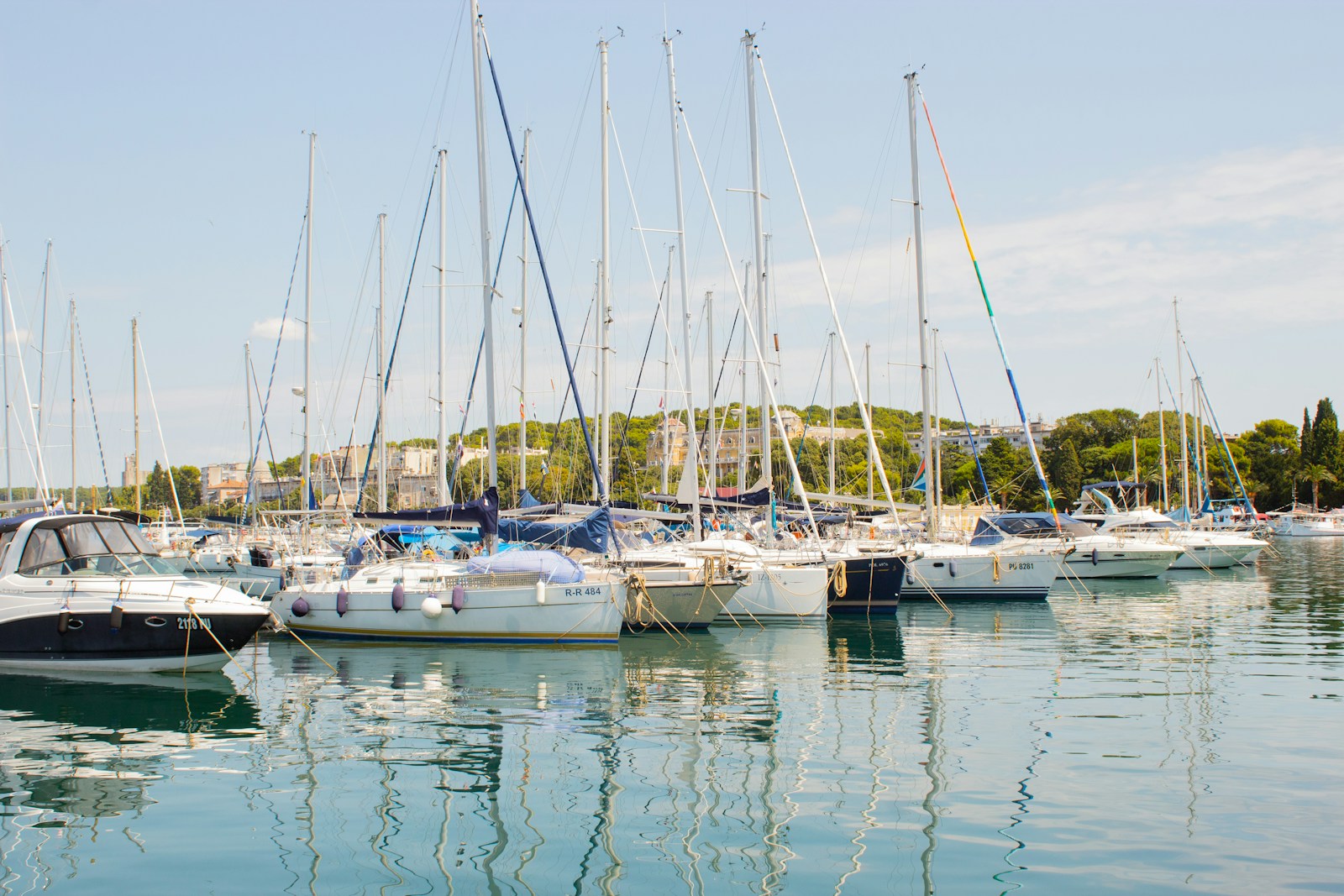 Sailing yachts underway in blue Adriatic water