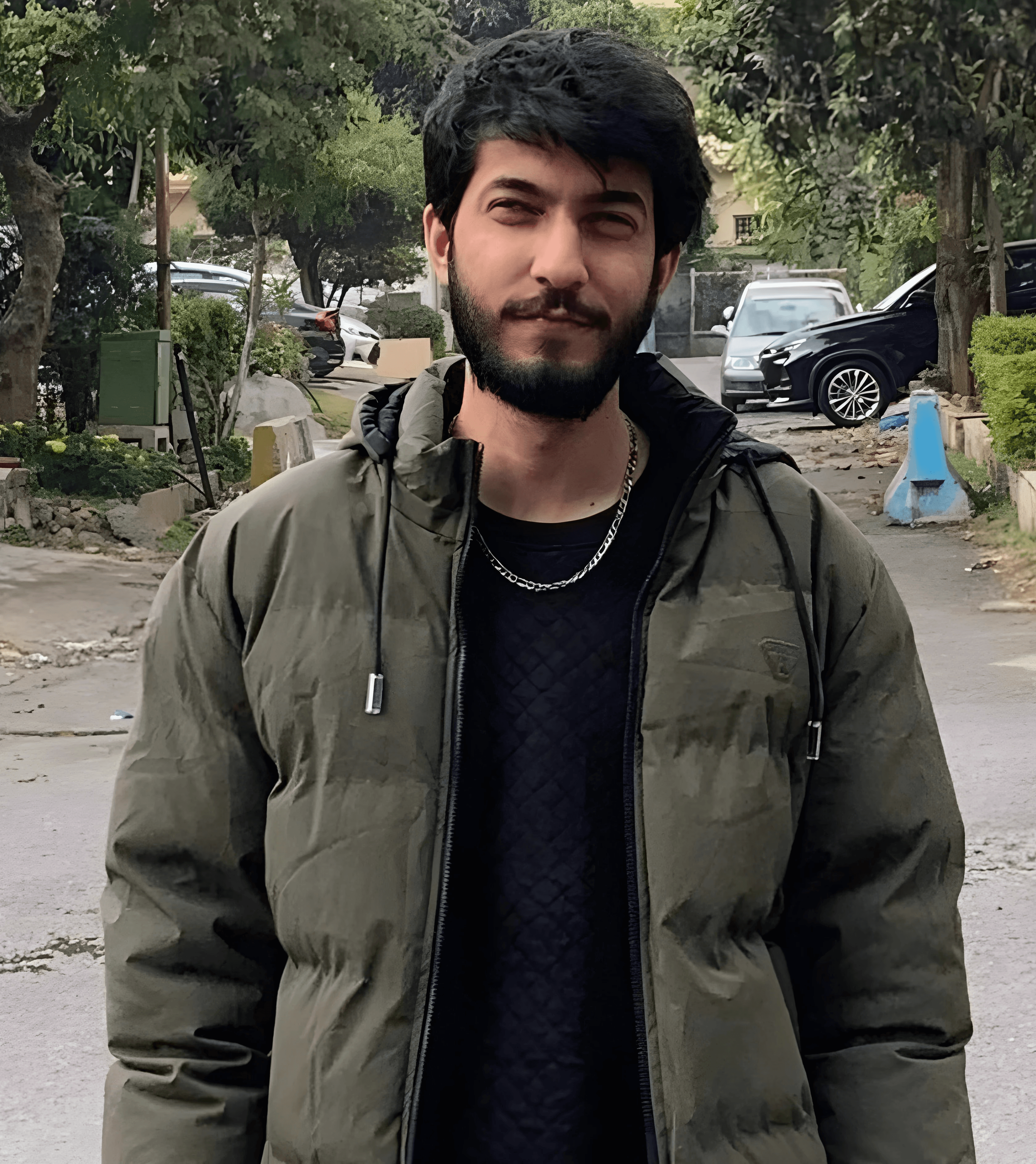 Aboubakar standing on a street and road