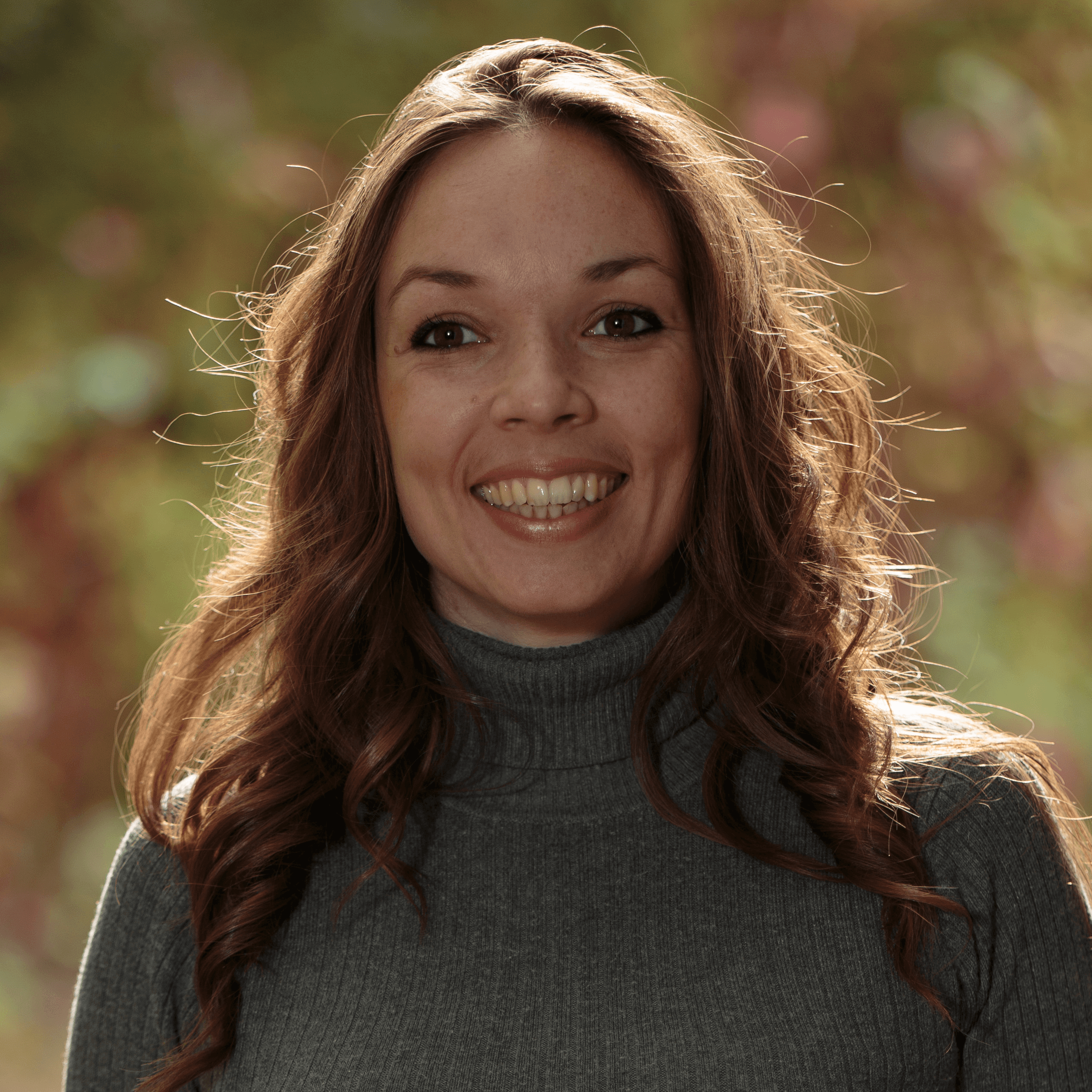 man smiling while sitting on floor during daytime