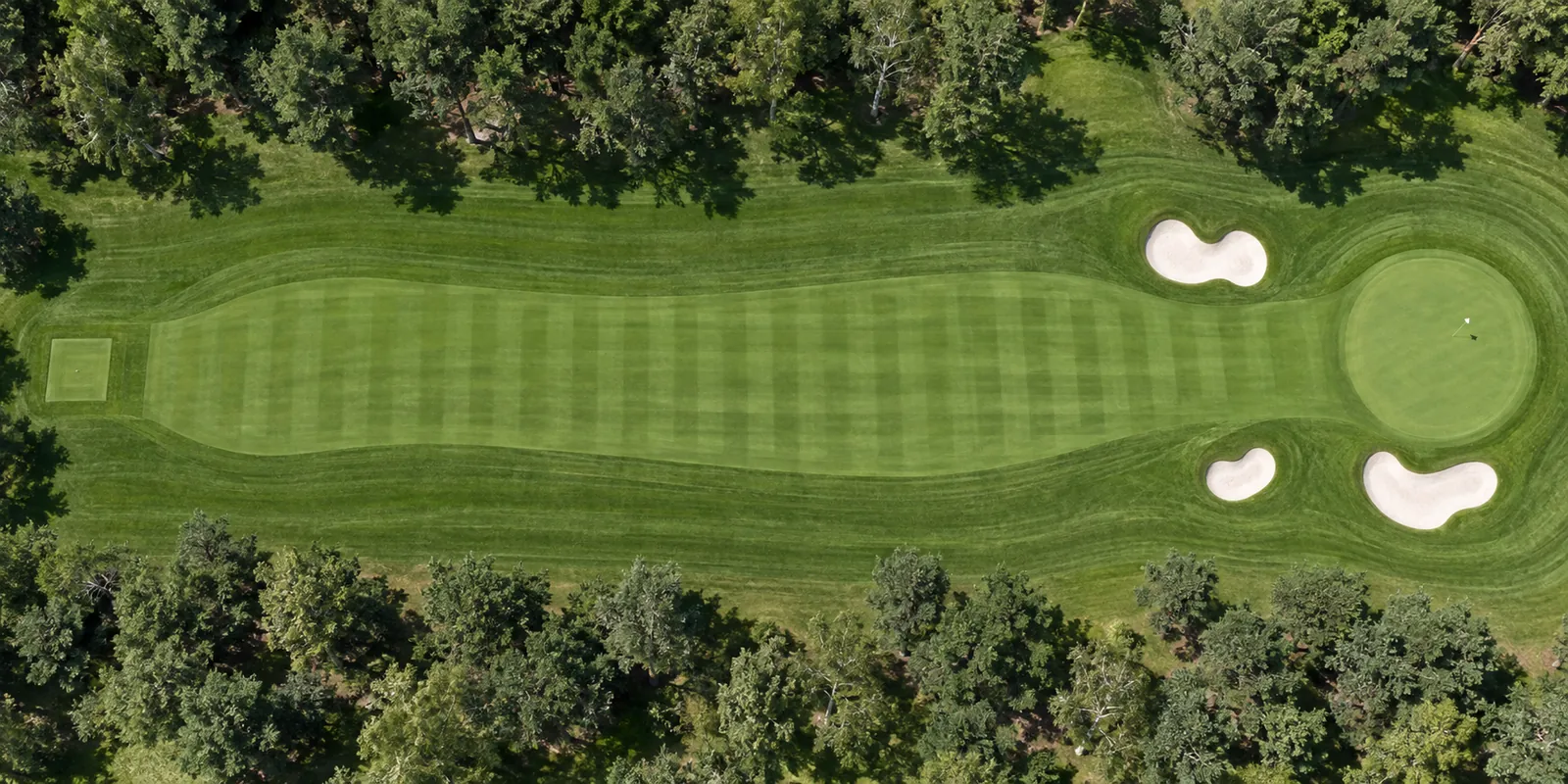 Aerial view of hole 6, Cutty, from the tee on the left to the green on the right.