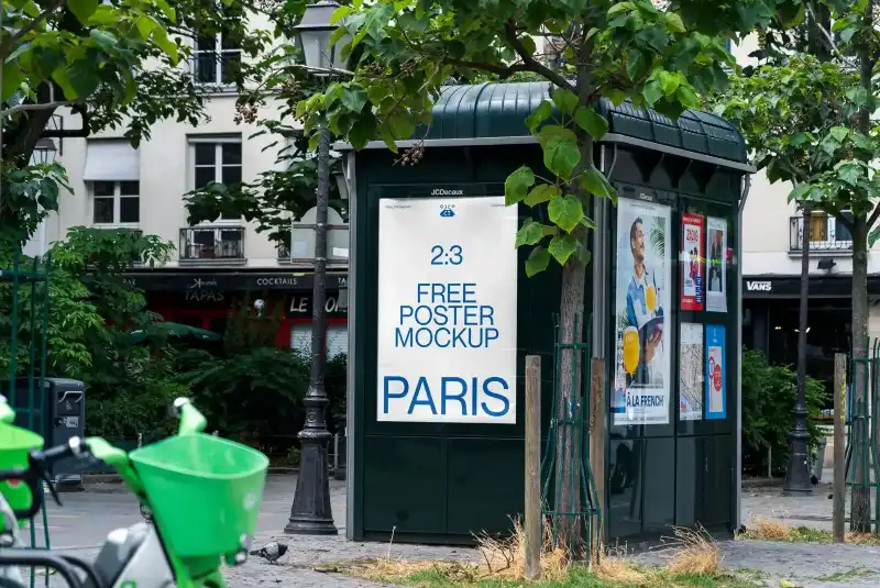 Outdoor poster mockup displayed on a bus stop in a Parisian street. Surrounded by greenery, urban architecture, and nearby bicycles, the scene highlights a vibrant city atmosphere.
