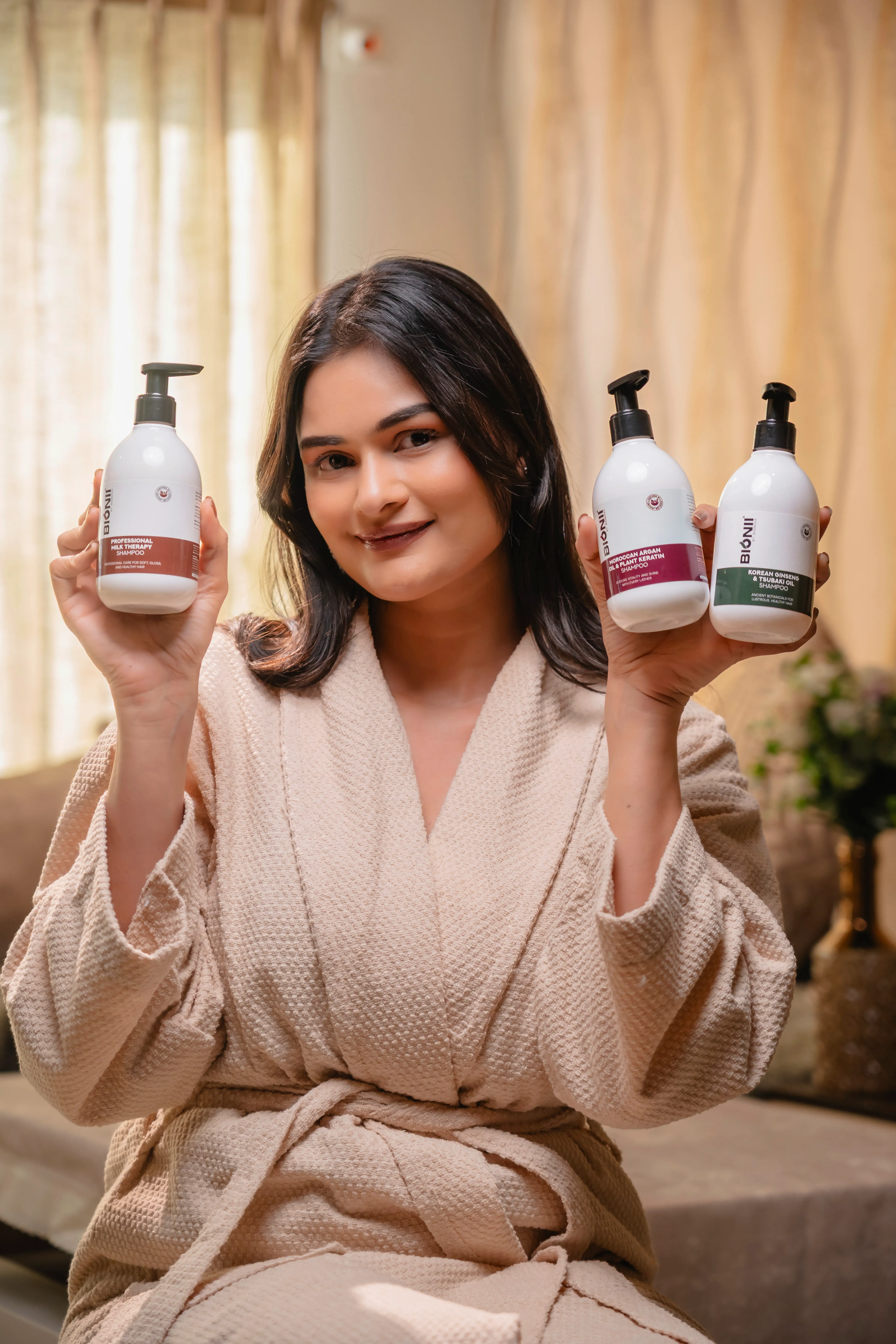 Smiling woman using Bionii self-care product at home