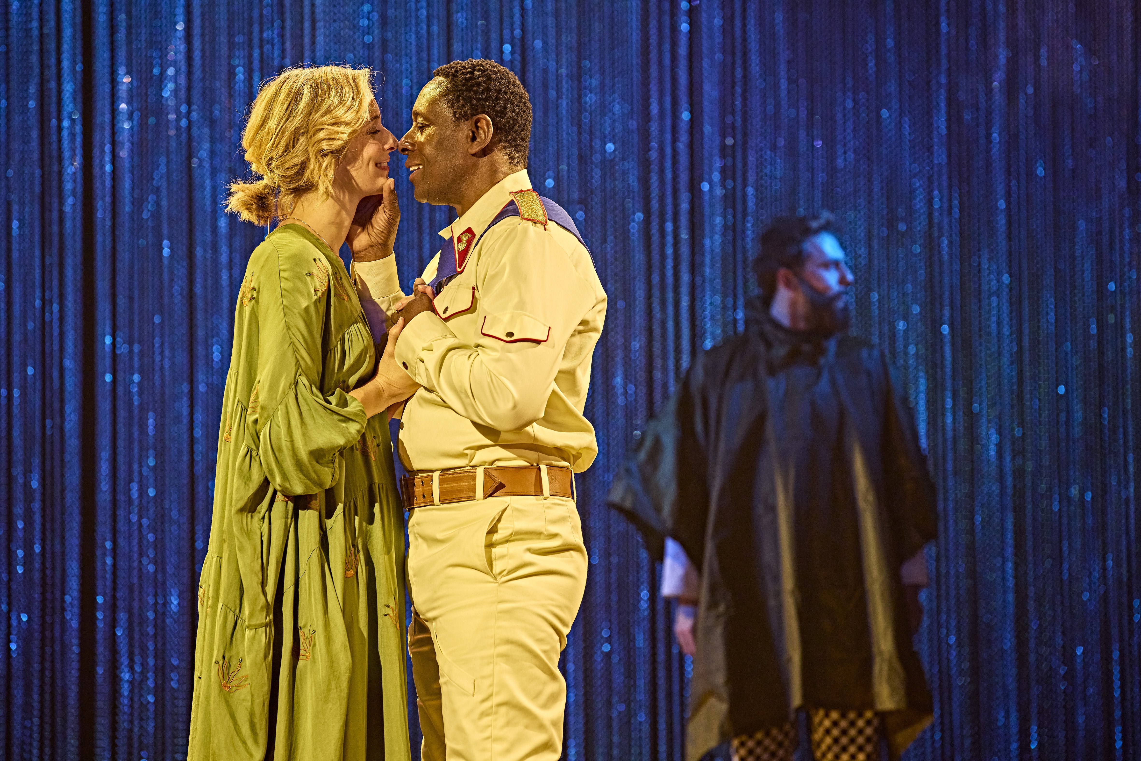 Othello West End intimate moment between two characters under blue stage light.