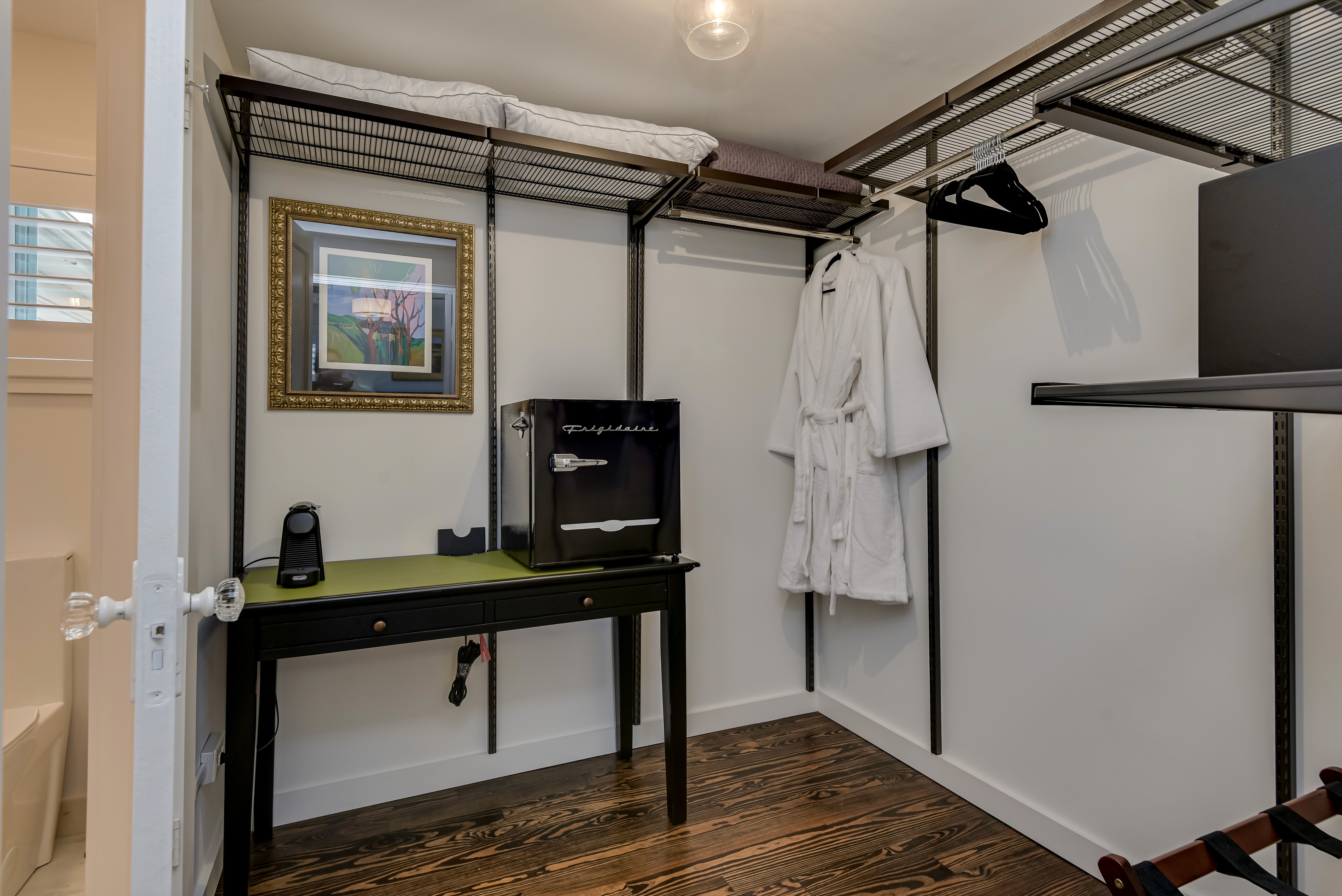 Large walk-in closet equipped with plush robes, personal Nespresso machine, electronic safe and mini-retro refrigerator stocked with complimentary water and sodas