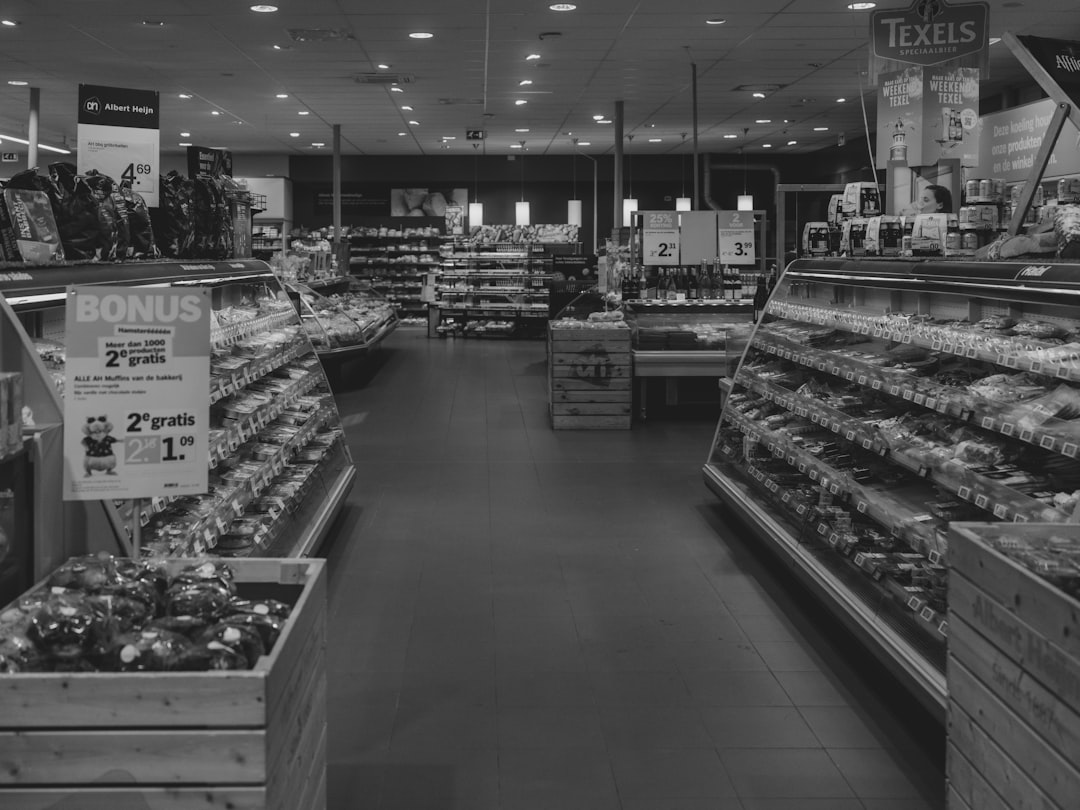 A supermarket's interior displays food on shelves.