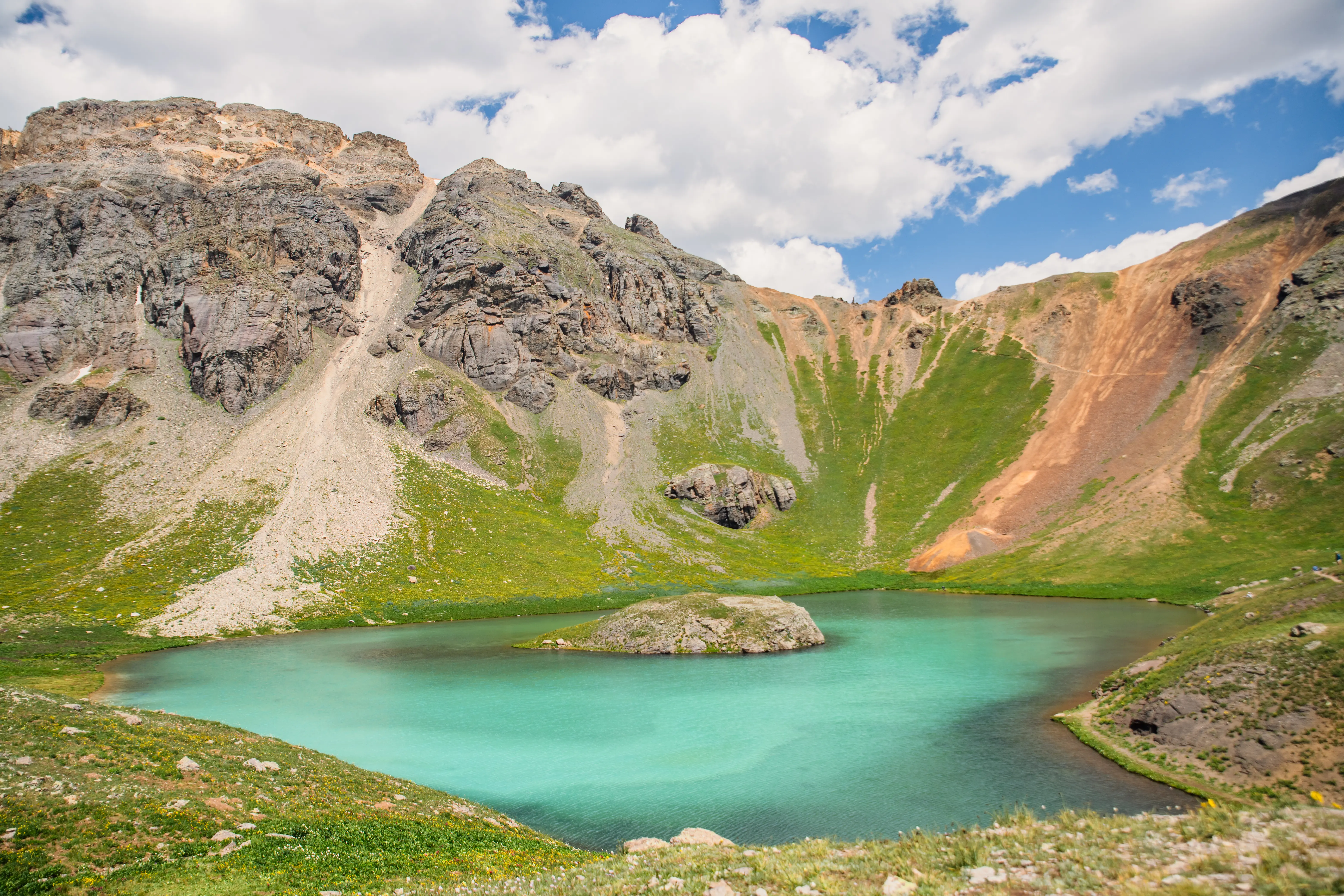 Streetside billboard with flyposters of the Batch.Works brand and illustrations