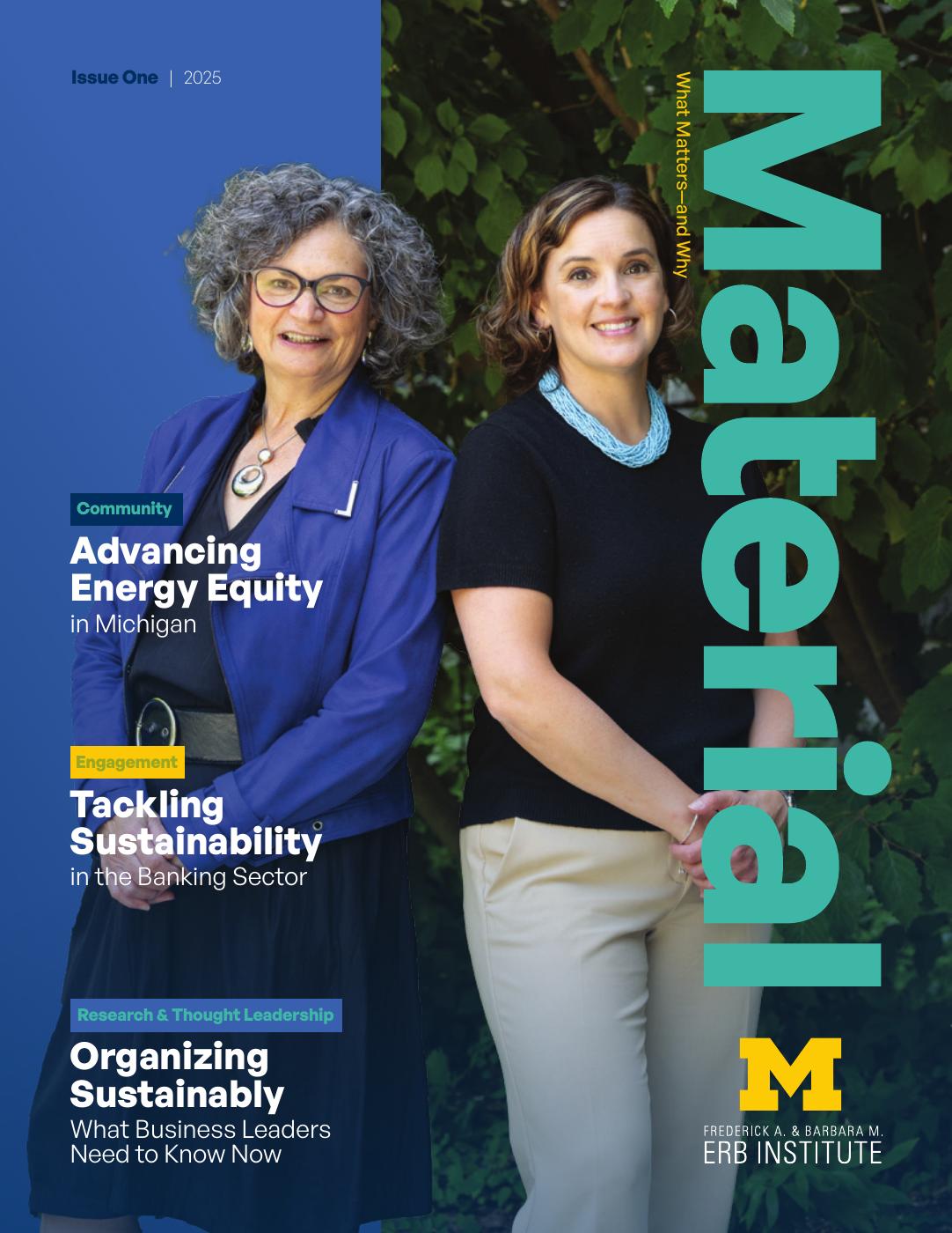 Two women stand side by side, smiling, with a magazine cover titled "Material" prominently displayed.