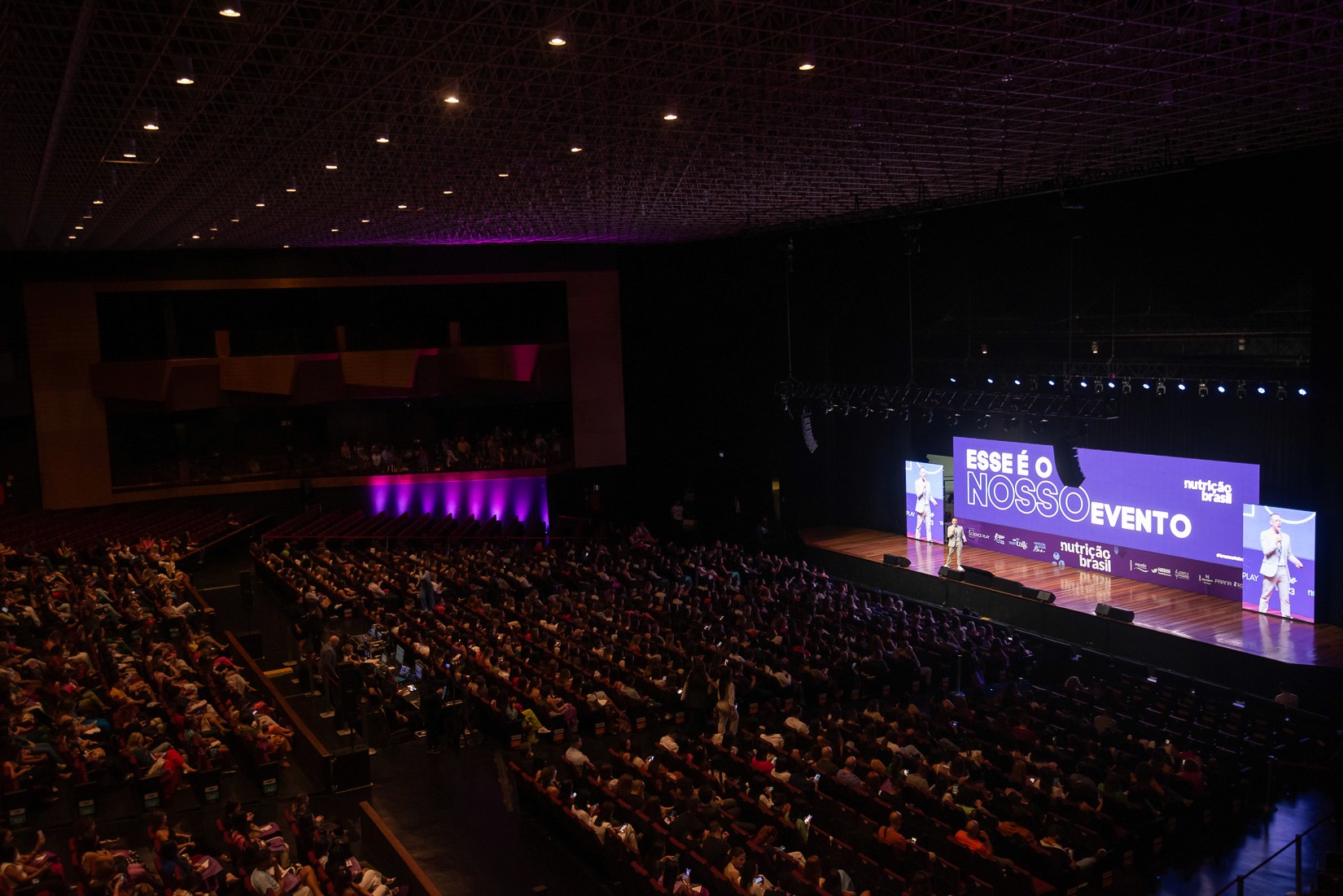 Group Taking a Selfie at a Concert Venue