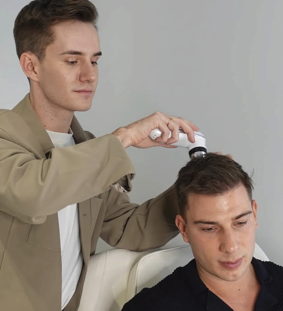 Shirtless man meditating indoors