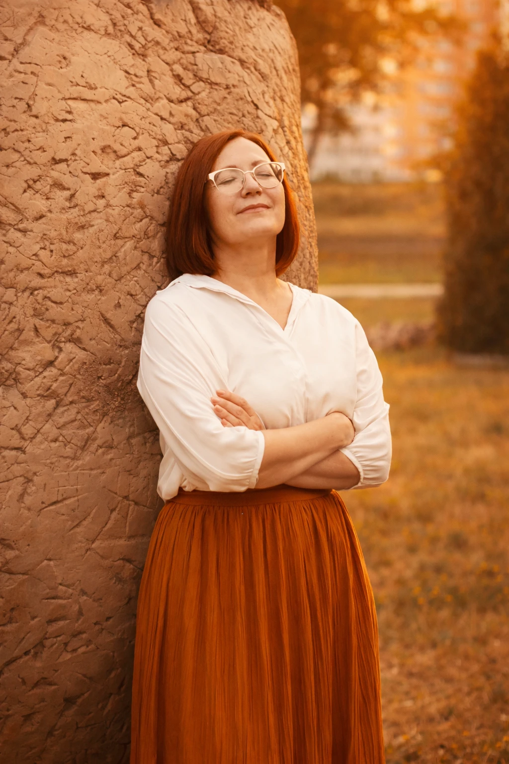 Woman reflecting outdoors, visualizing health patterns with Neura Health