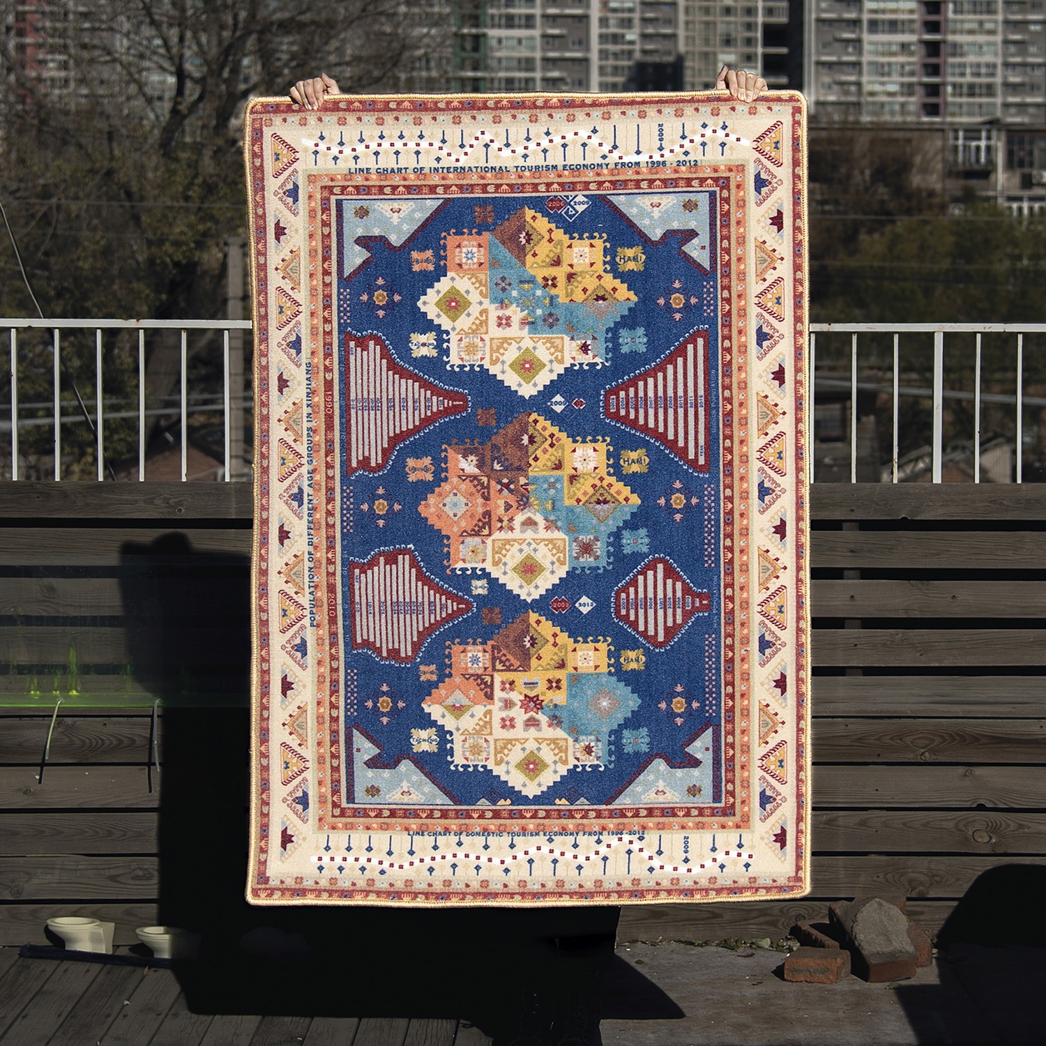 person holding carpet designed by Miao Zhao