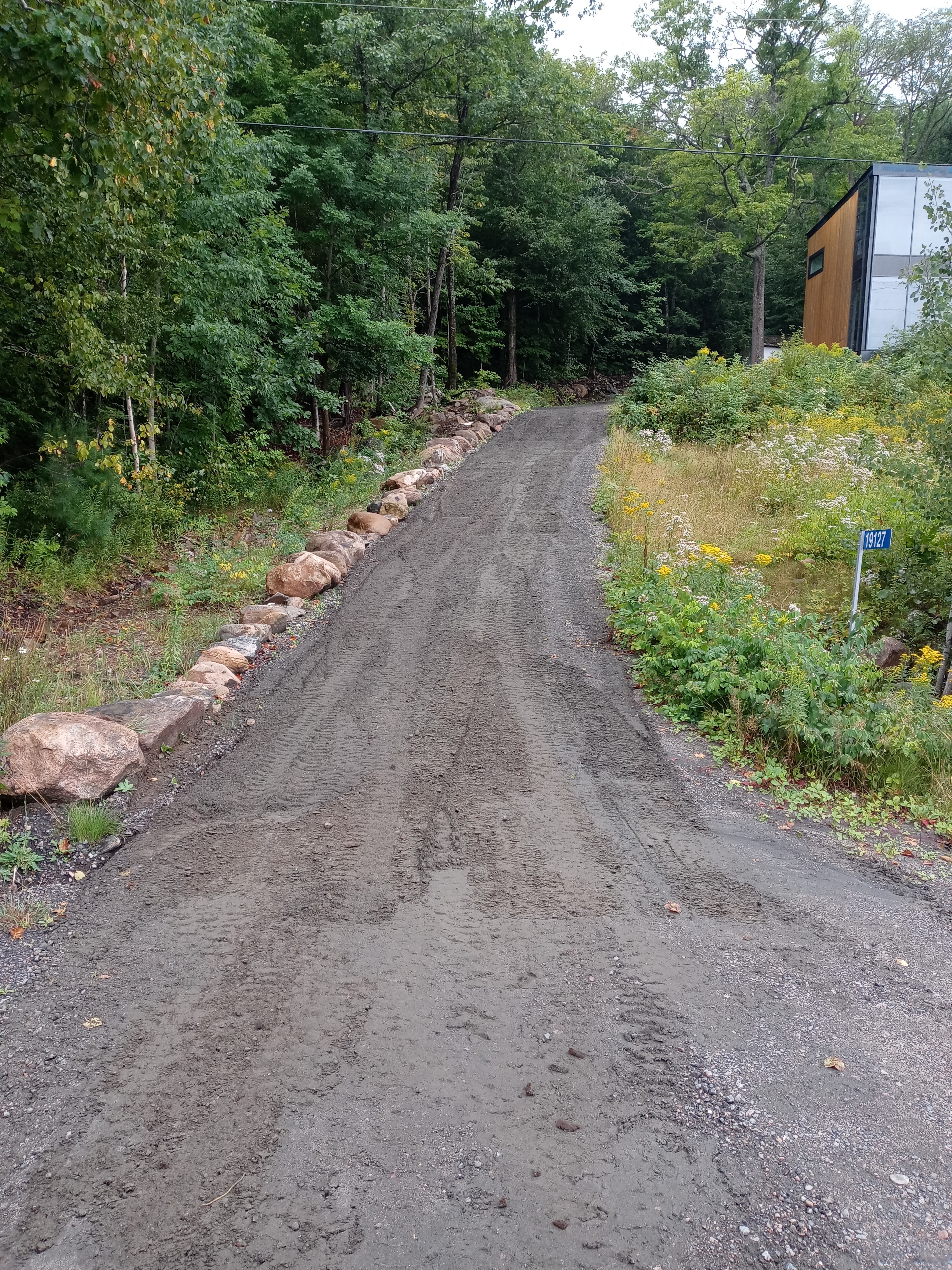 Cottage driveway reshaped and regraded after a major washout.