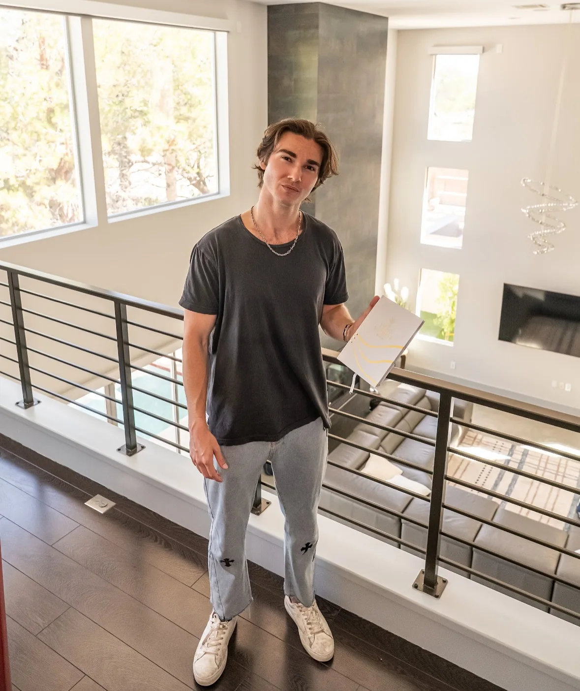 Trey Colley, founder of the Dream Life Program, posing professionally for his business about section.