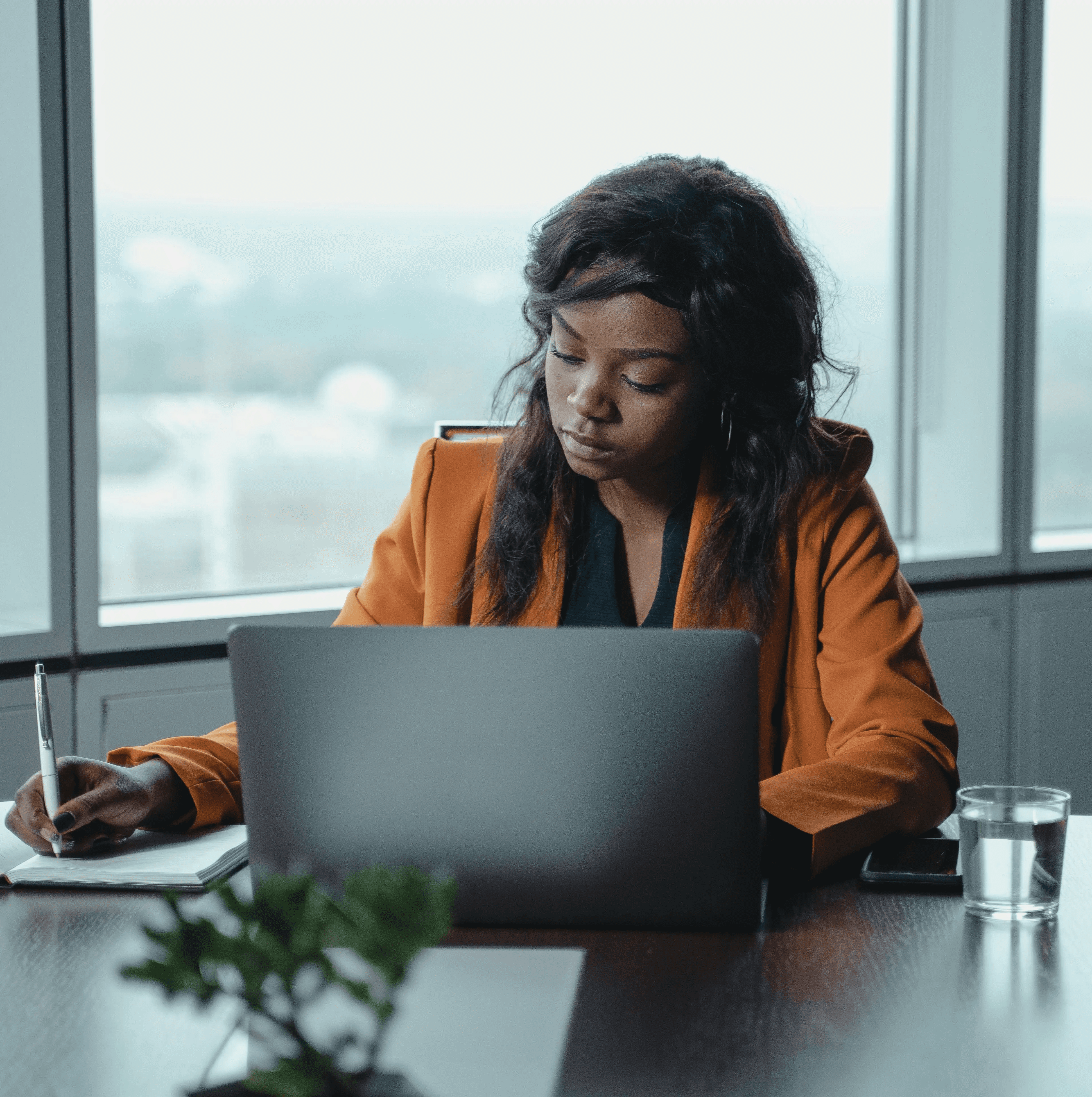 Expat professional tracking job search applications in notebook and laptop in Germany