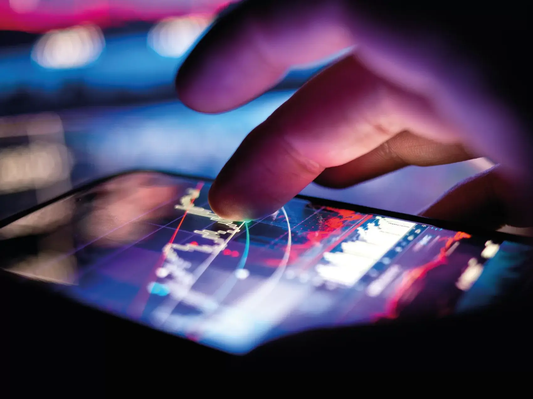 Image of a close up view of a finger tapping a mobile phone screen, the screen has some form of graph on it