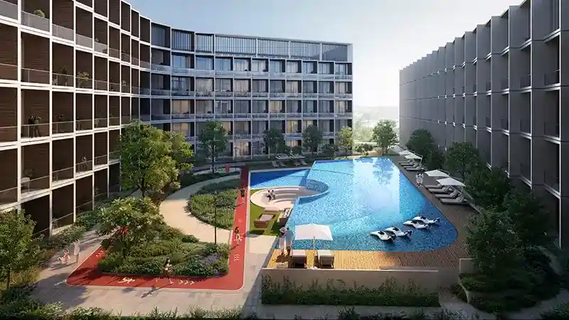Luxury amenities at Binghatti Hillcrest featuring a resort-style pool and landscaped jogging track.