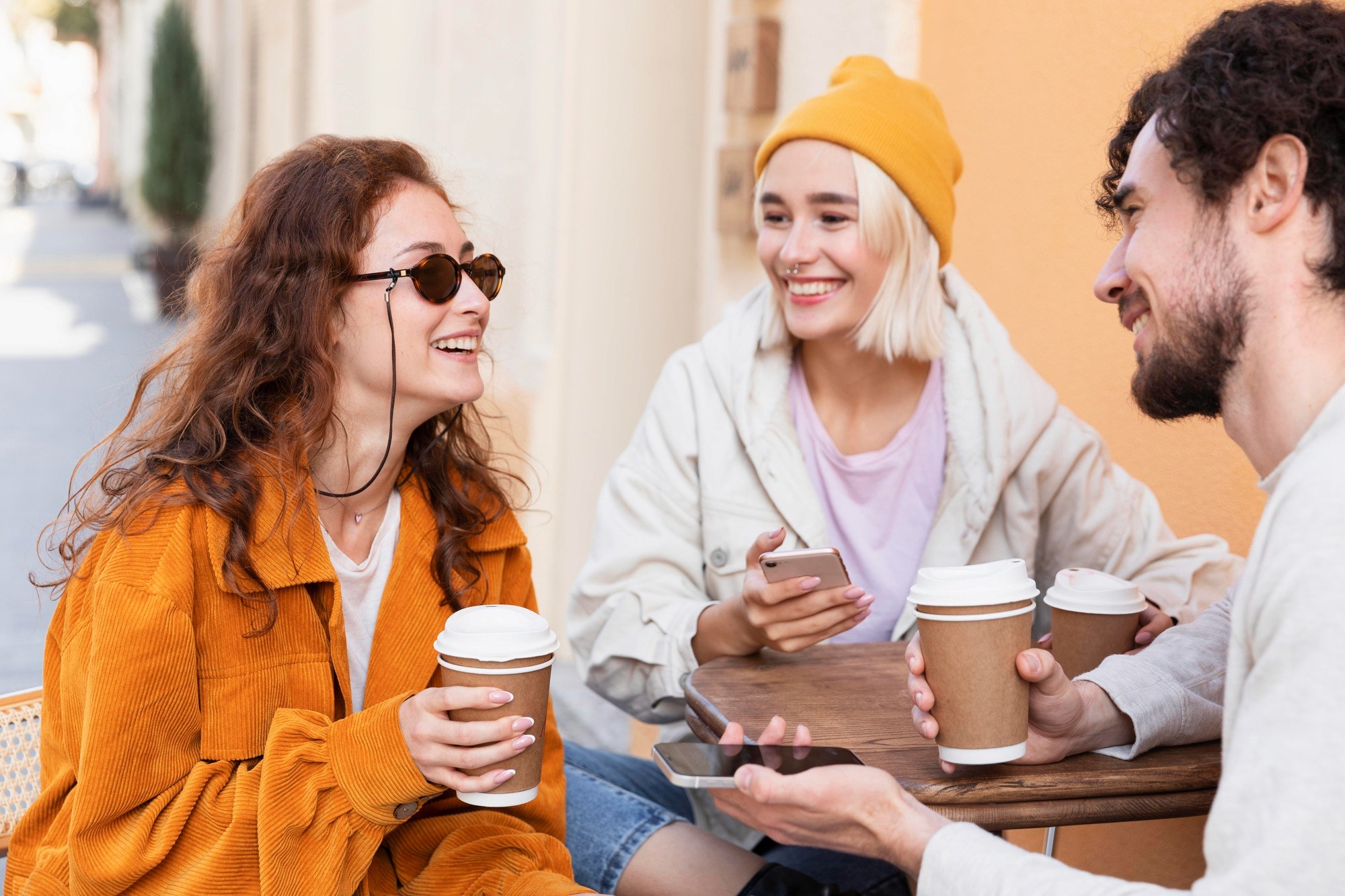 Friends gathered around enjoying coffee, promoting sober socializing and meaningful connections.