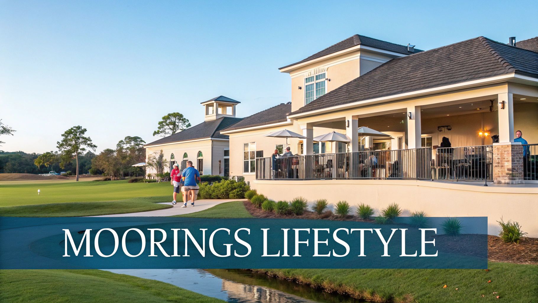 A sunny view of a golf course clubhouse with people walking and relaxing on the patio.