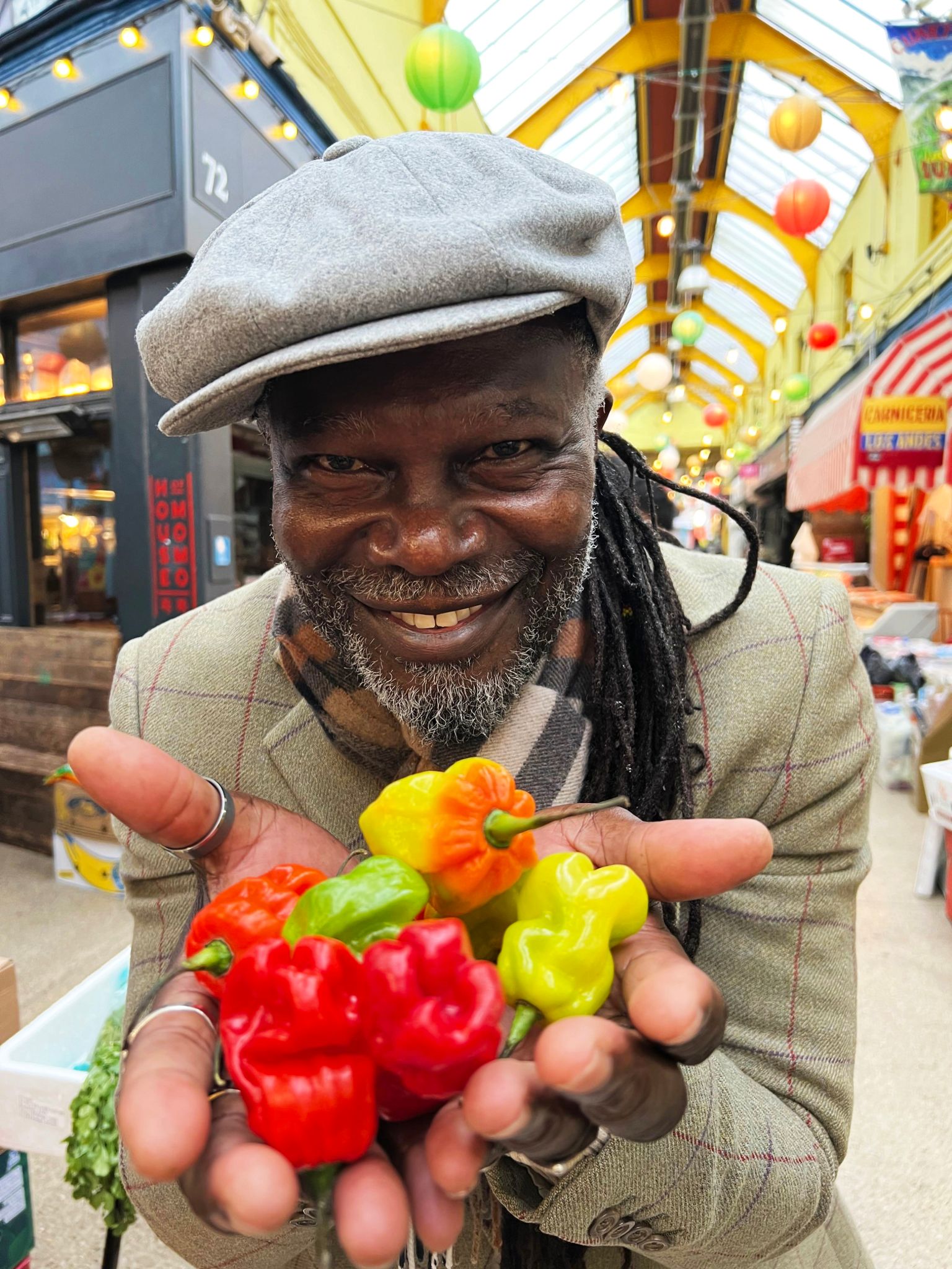 Levi Roots holding scotch bonnet chillis