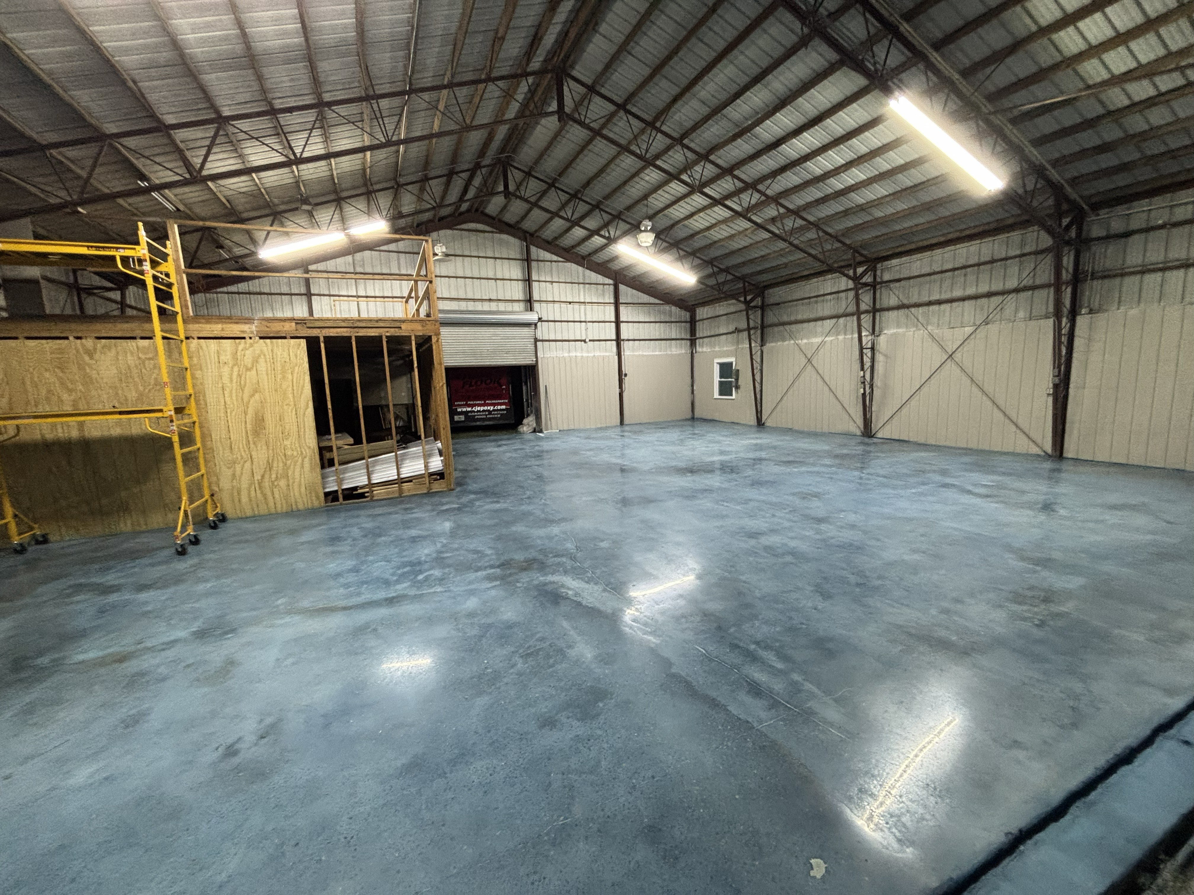 CJ Epoxy grind stain and seal hangar floor project