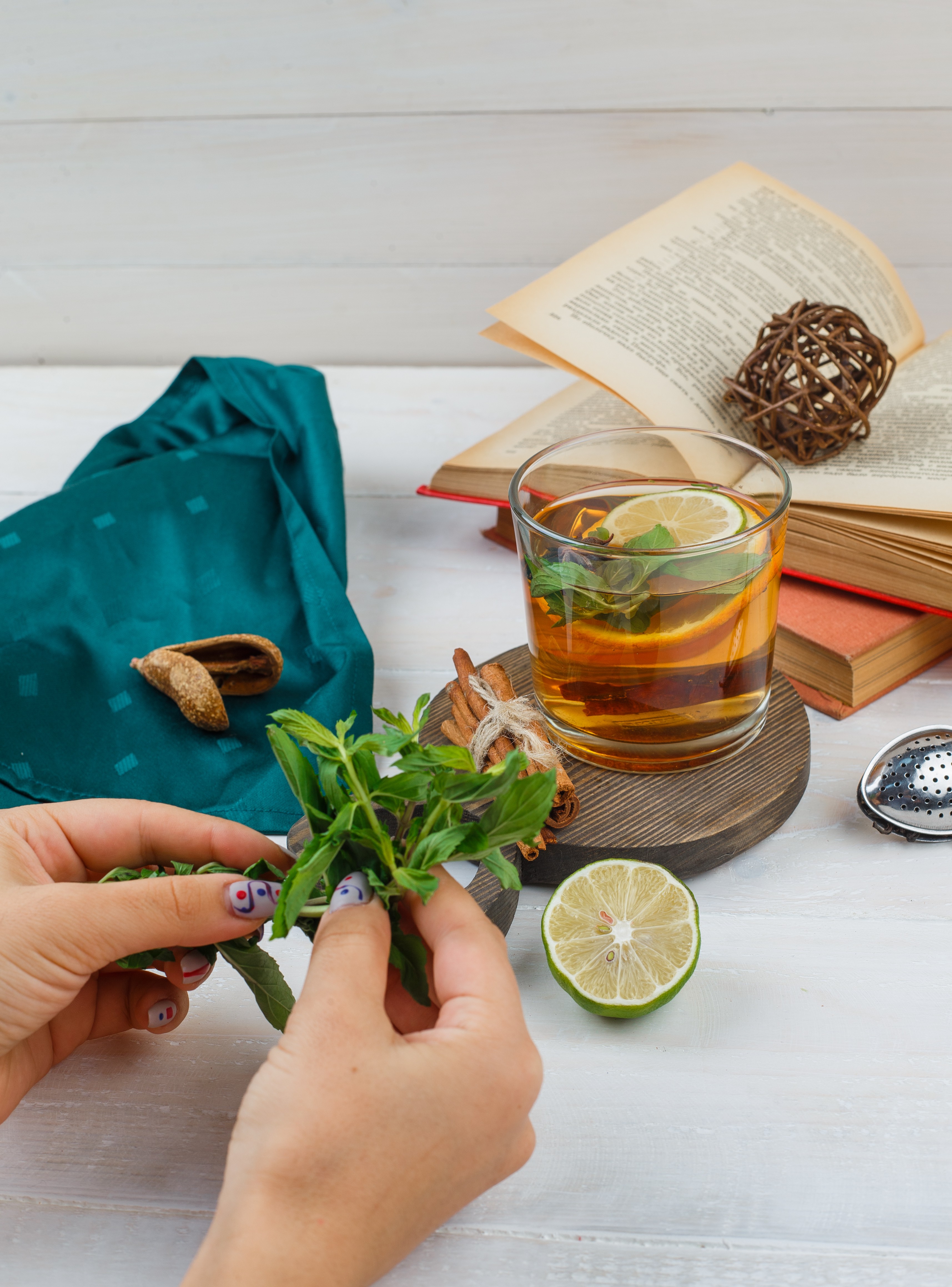 Herbal tea preparation with mint and lemon, symbolizing naturopathy, yoga-based healing, and holistic health in the Bachelor of Naturopathy and Yogic Sciences