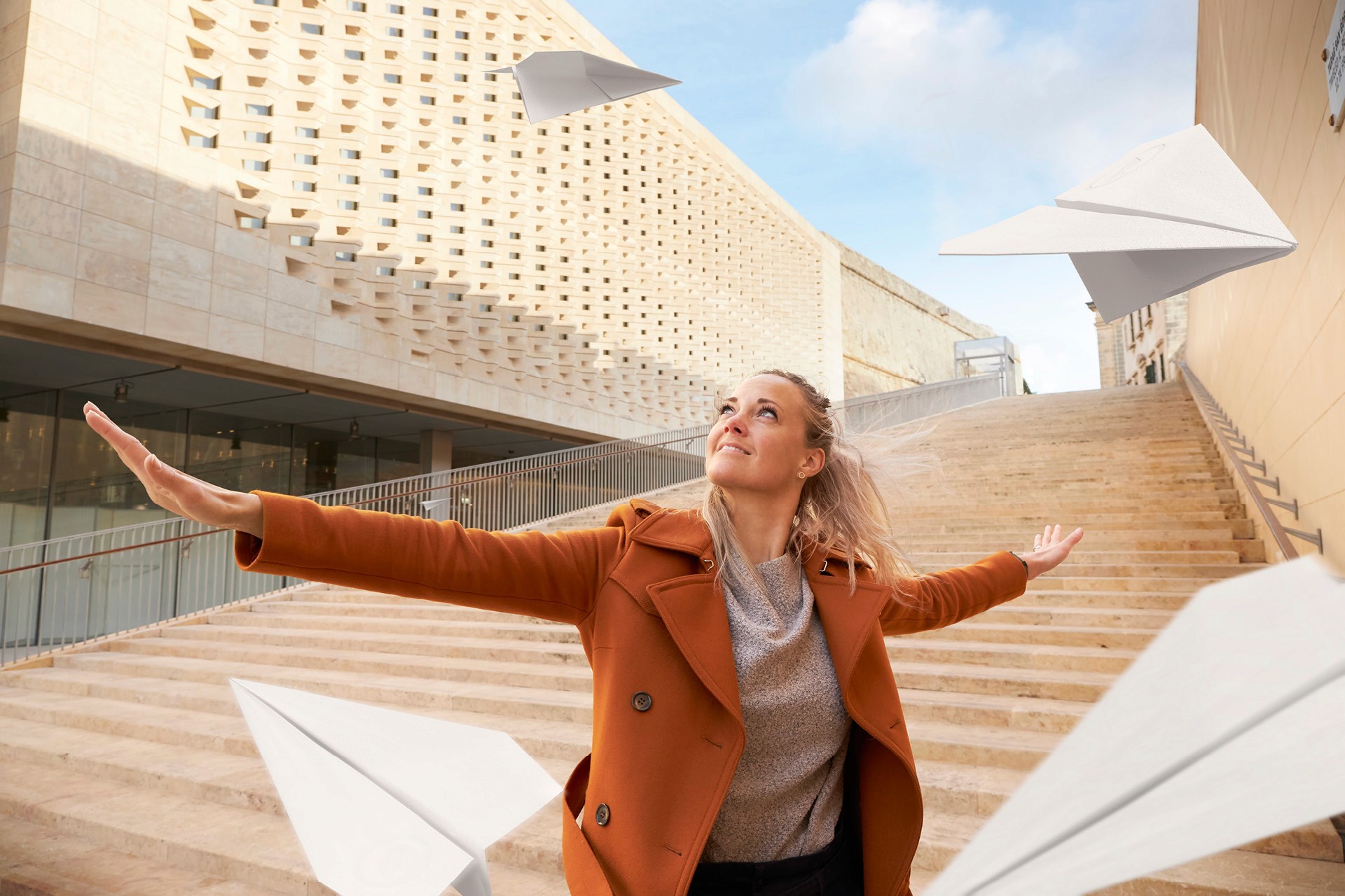 Woman with paper airplanes