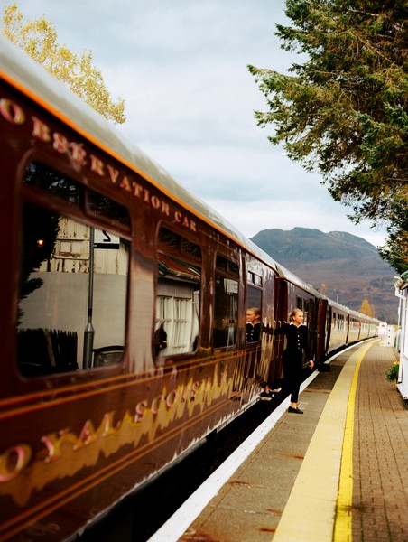an aerial view of a baseball stadium with a city in the background