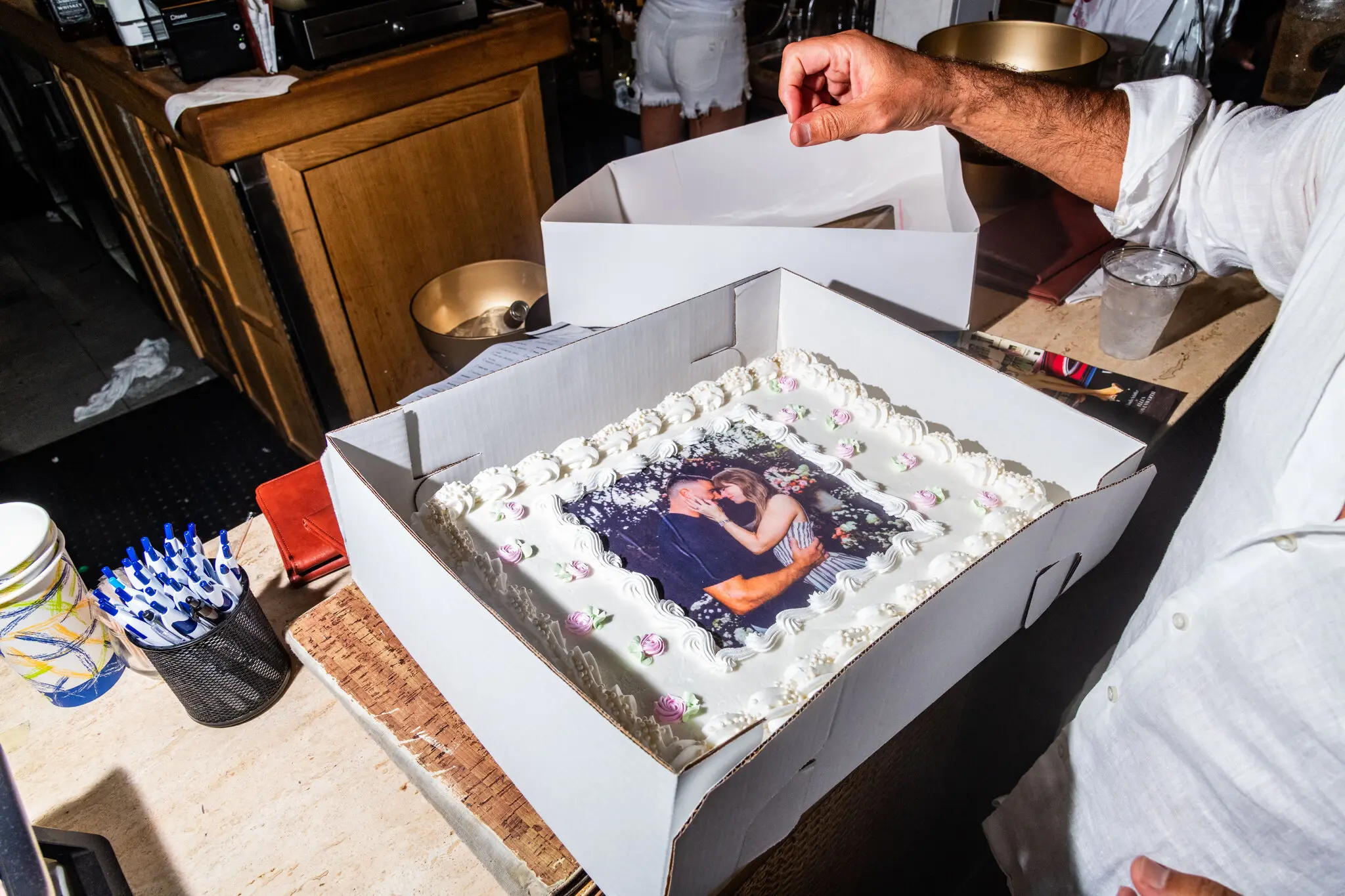 A bakery prepares a cake featuring Taylor Swift and Travis Kelce