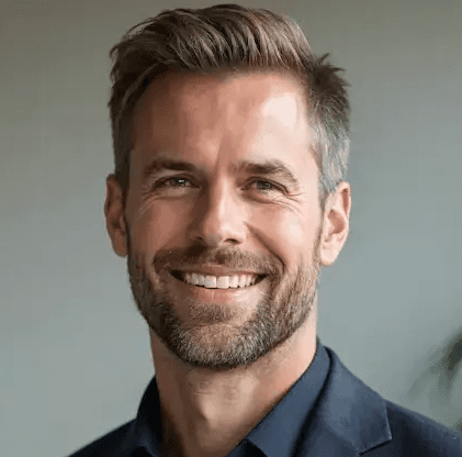Marcus Holm, independent consultant, smiling in a modern office