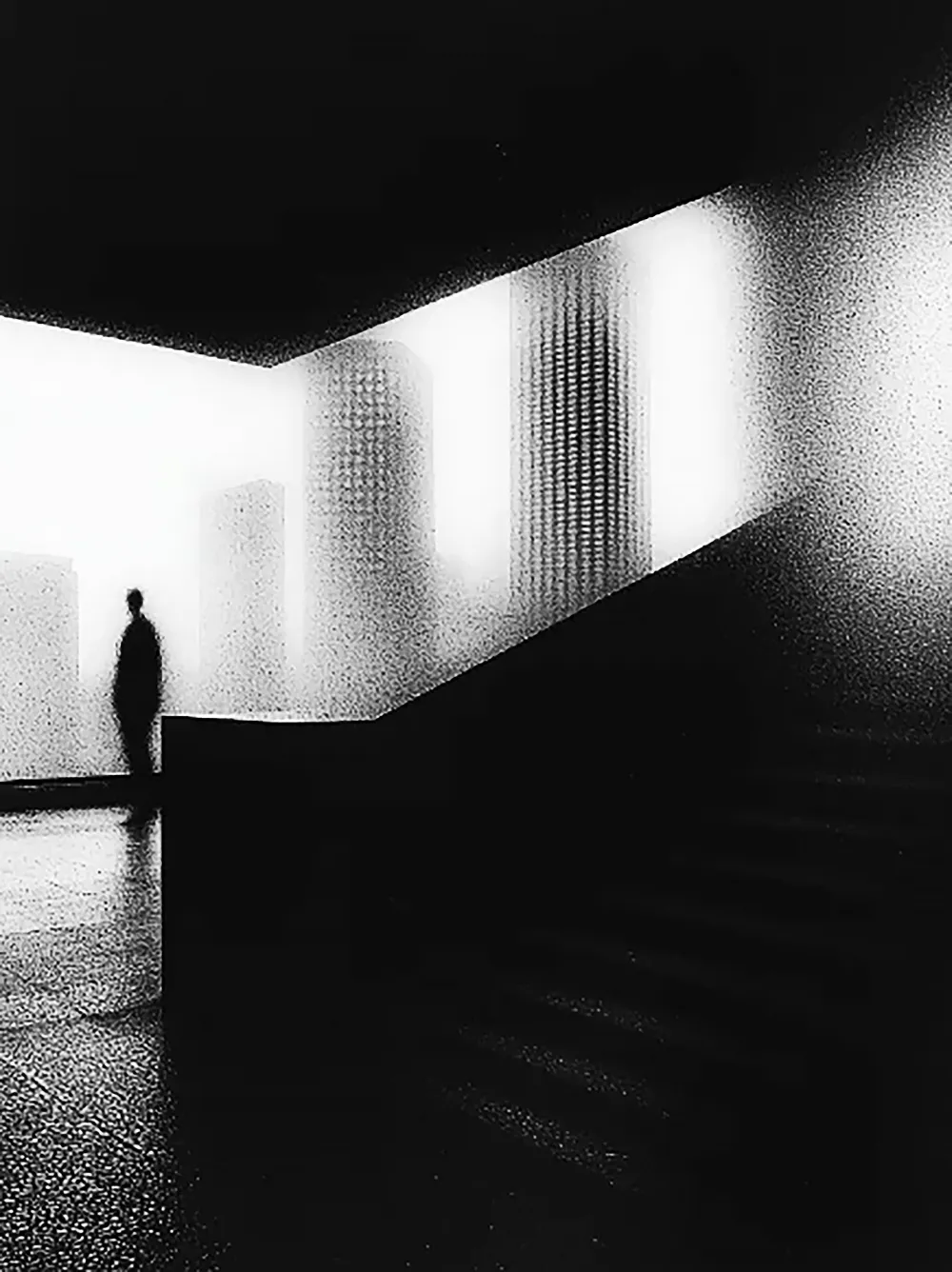 Modern skyscrapers line a busy highway in a sprawling city.