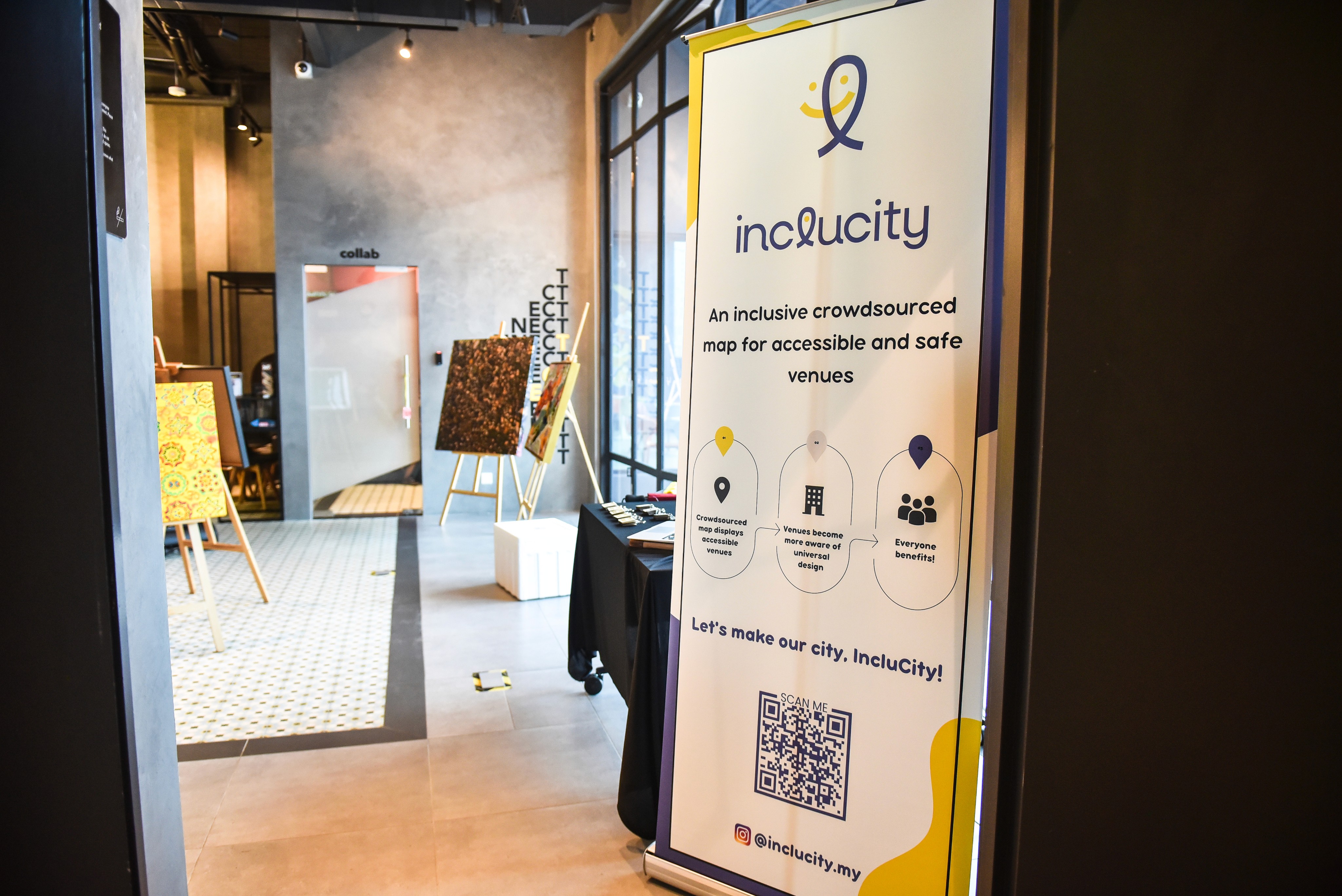 IncluCity banner placed at an event for creatives to mingle