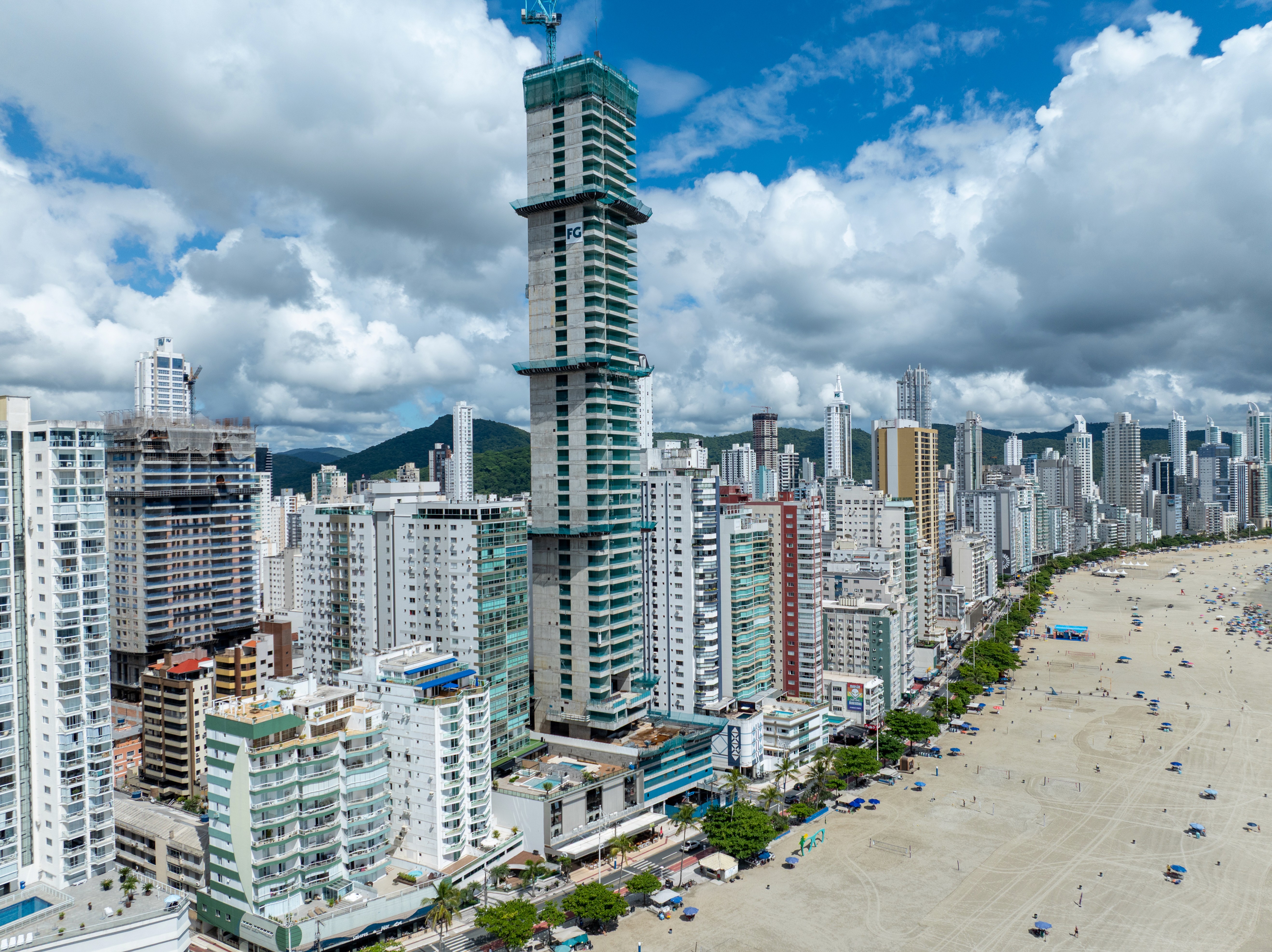 A quaint house surrounded by colorful flowers under a soft, muted sky with distant trees in the background.