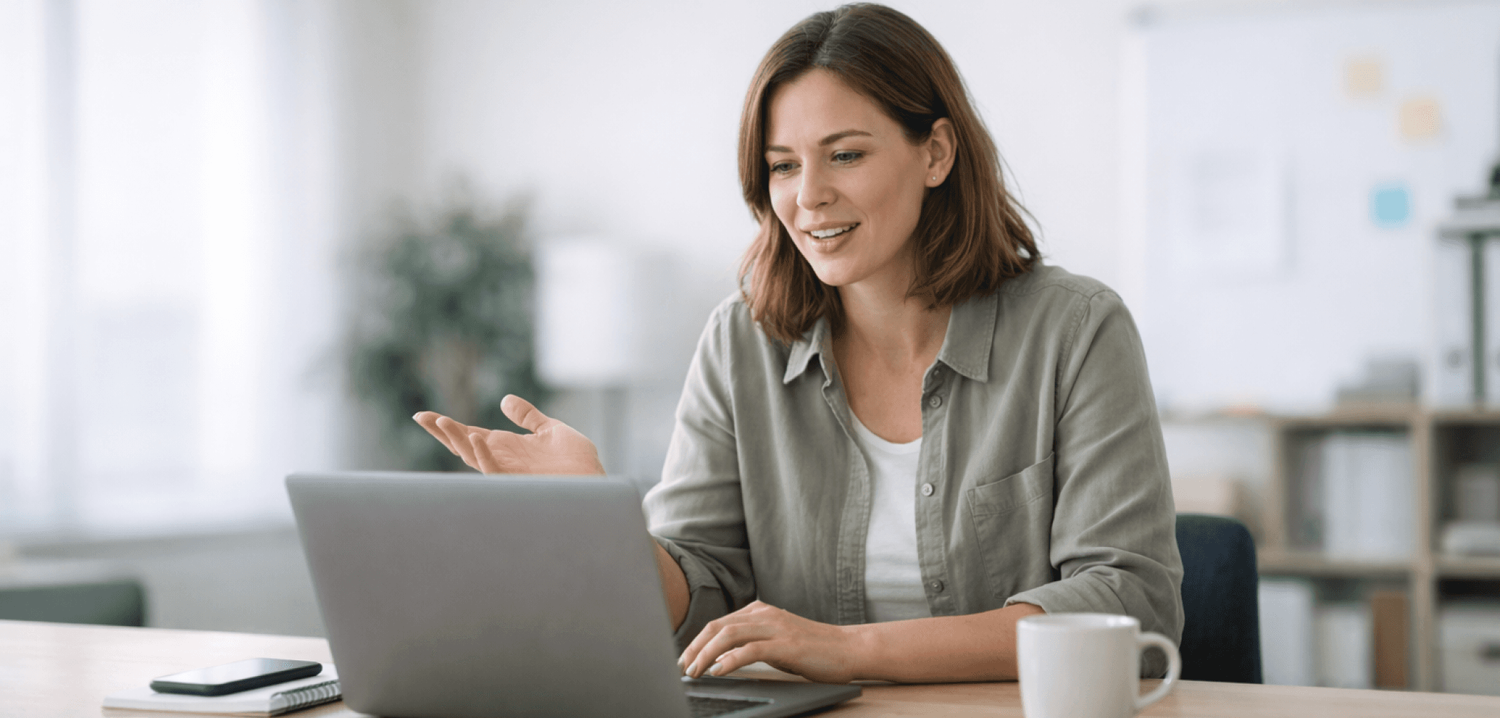 Usability testing participant giving feedback during a remote UX research session while using a laptop to review a digital product prototype.