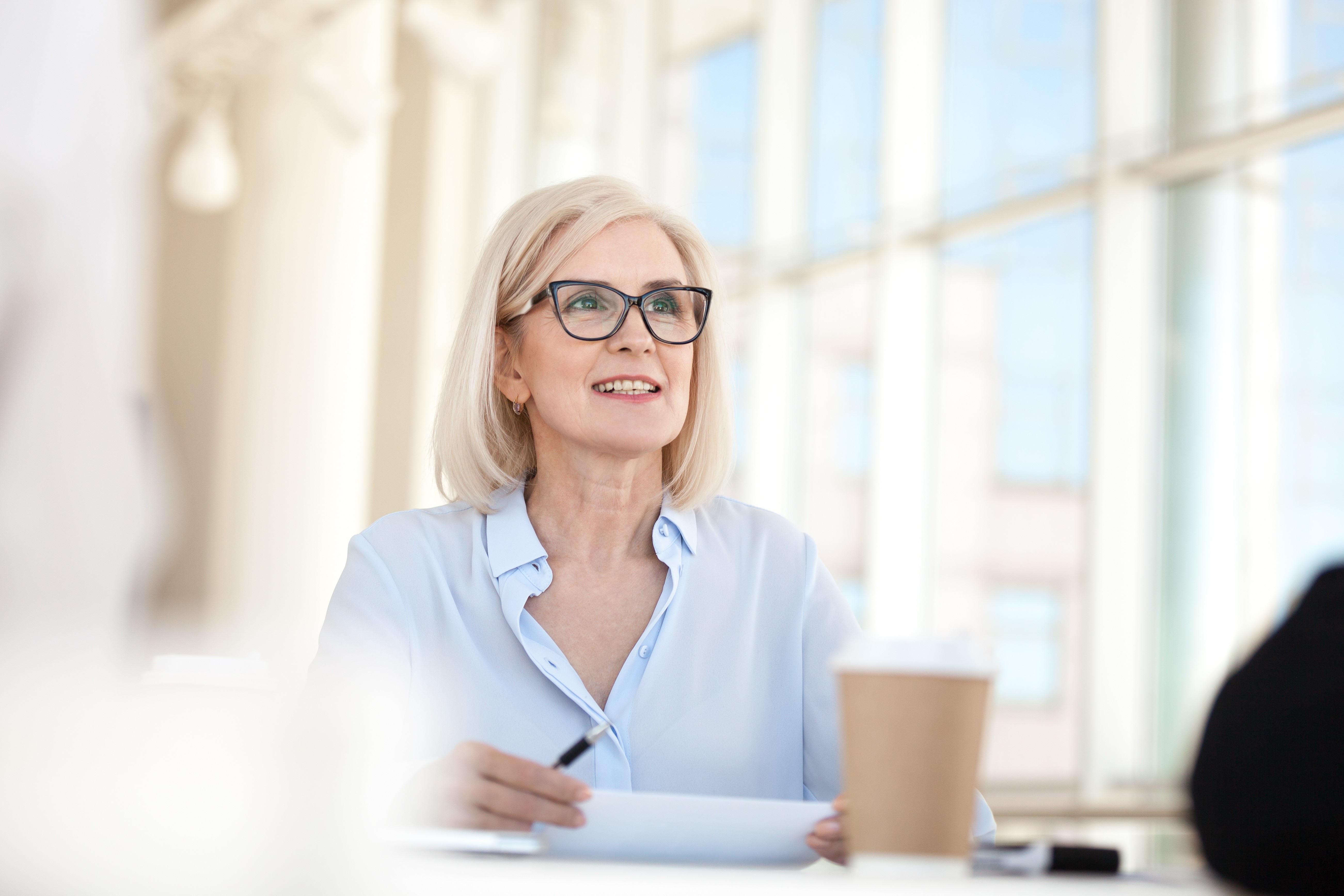 Executive receiving real-time AI feedback on communication style and vocal presence