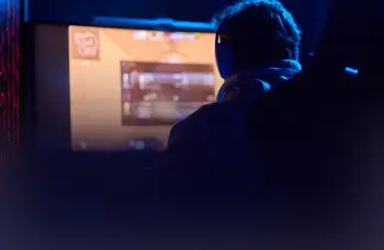 Person playing multiplayer game on computer
